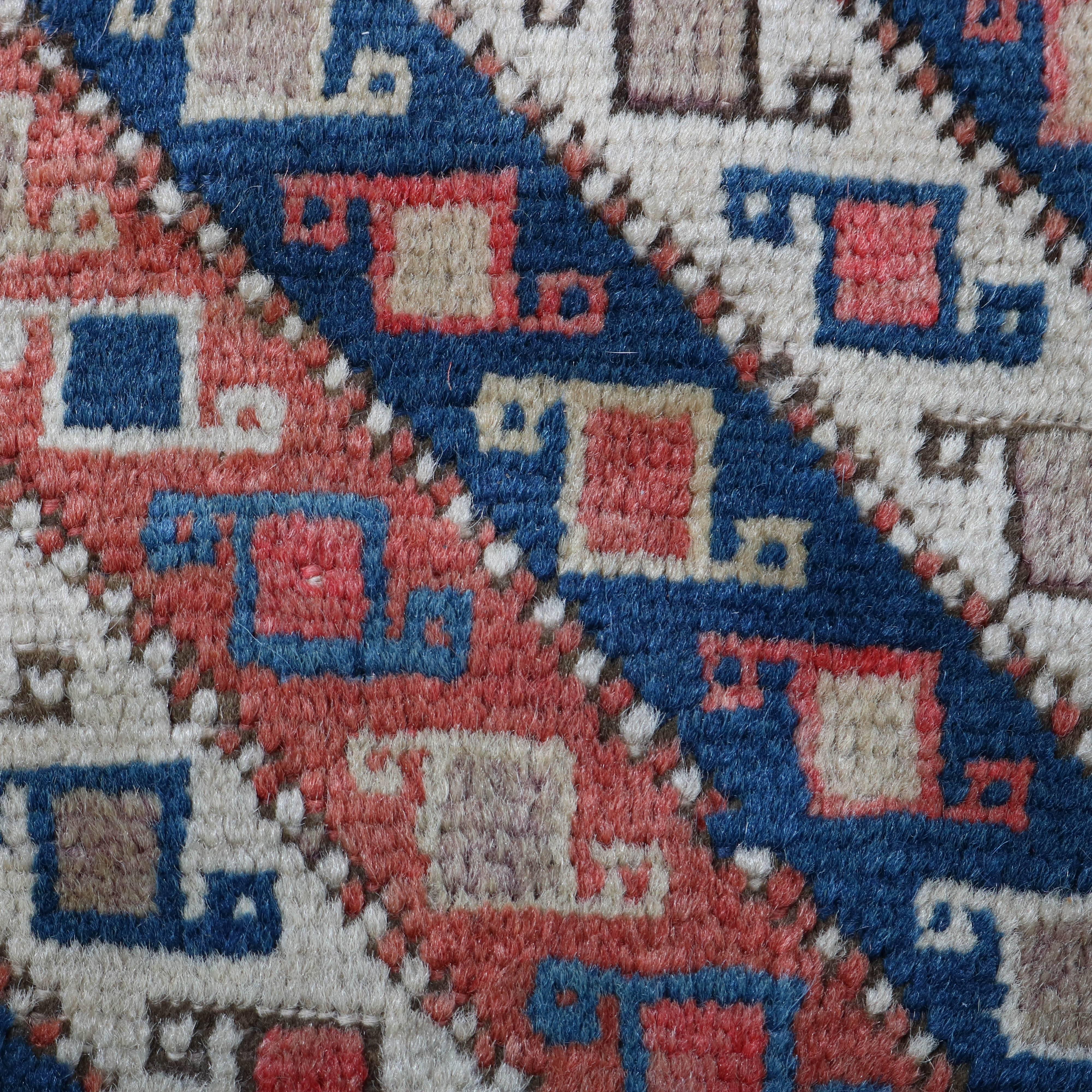 Antique Caucasian Gendje oriental mat features traditional geometric pattern on cream ground.

Measures - 20" x 17".