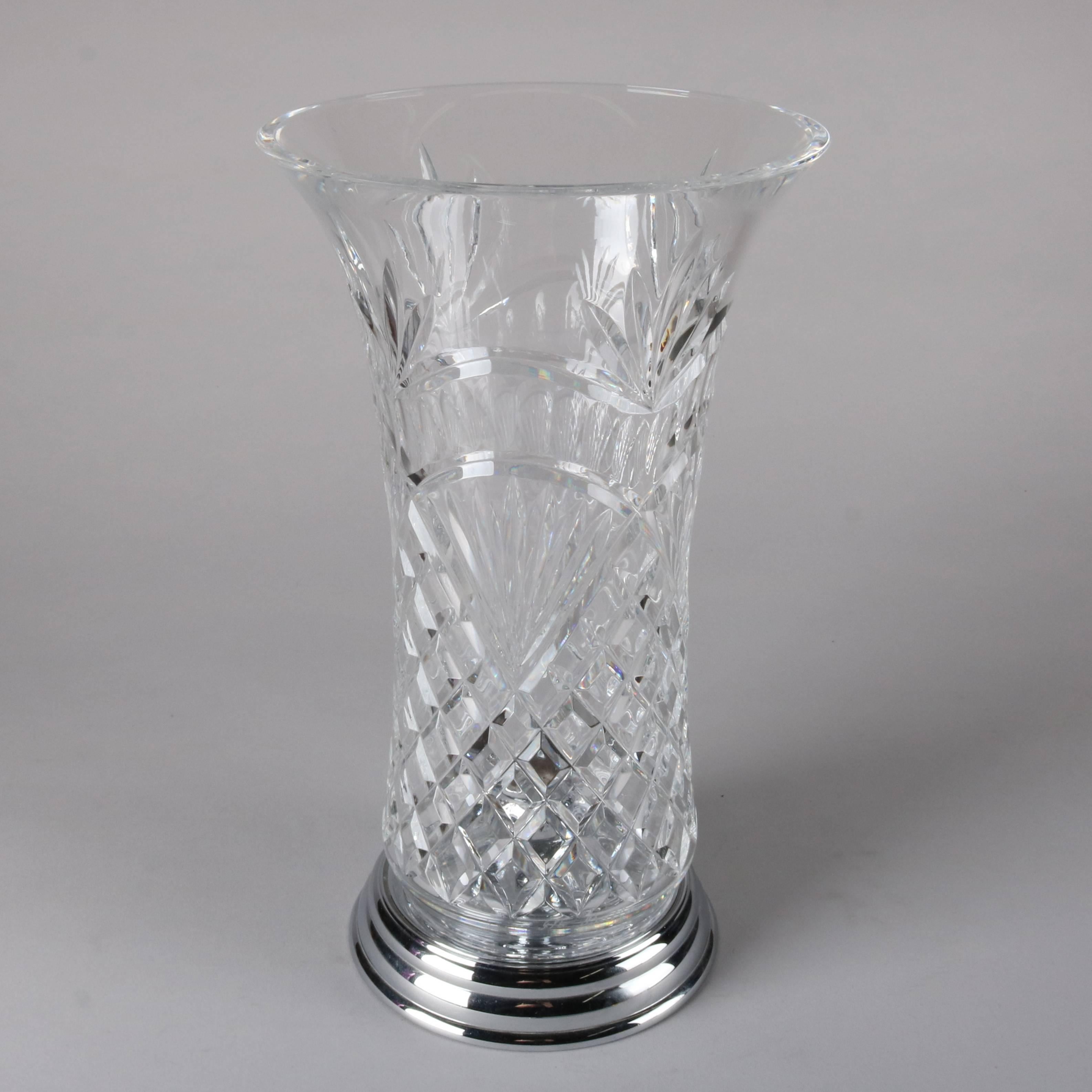 Contemporary Waterford cut lead crystal candle light features diamond pattern, flared form, engraved "Mothers Day 2003", accommodates single taper, Waterford stamp on base

Measures: 12" H x 7" W, W x 5.5" BS.