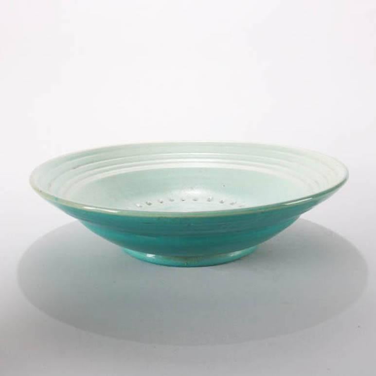 Mid-Century Modern hand-thrown studio pottery centre bowl features aquamarine glazed exterior with milky white interior and central hashtag form motif, mid-20th century 
Provenance: Deaccessioned from the Call Museum, Hartsville, New York


Measures