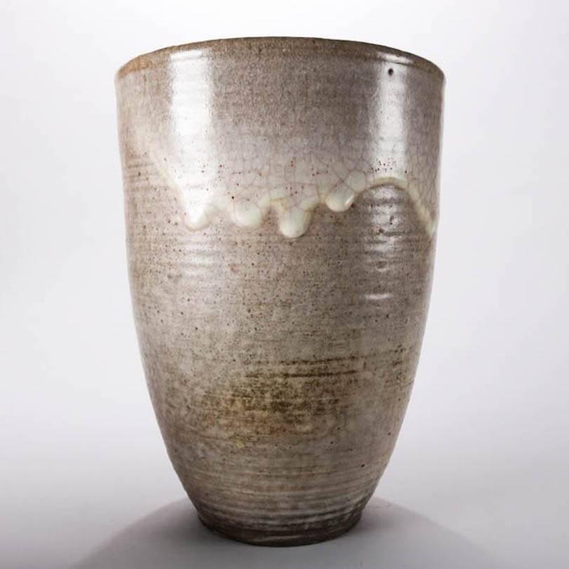 Oversize Mid-Century Modern hand-thrown flared vase features drip glaze exterior with gloss interior glazing, mid-20th century
Provenance: Deaccessioned from the Randy Webb Collection of the Call Museum, Hartsville, New York

Measures - 13.25"