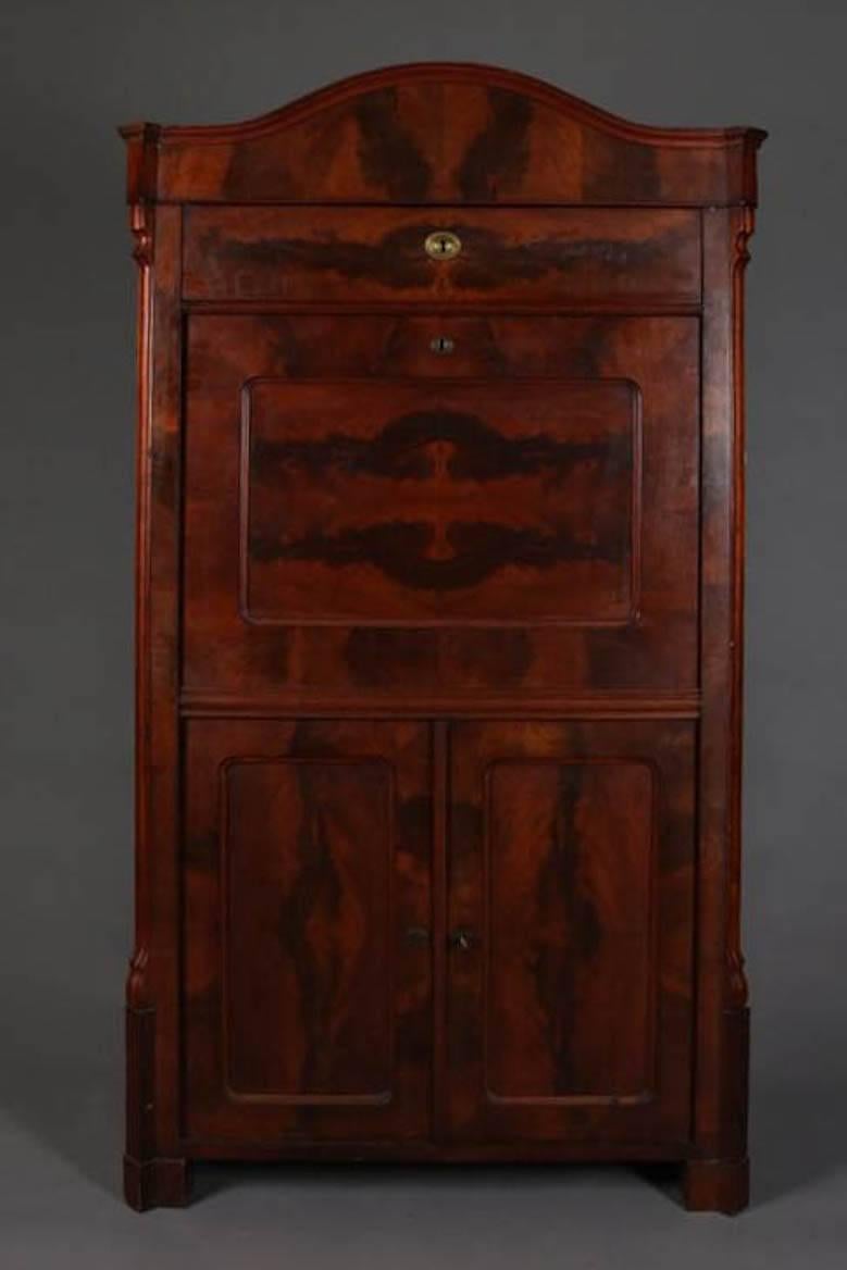 Antique flame mahogany Biedermeier Abattant Secretary features drop front writing surface with interior pigeon holes and drawers, above lower storage, 19th century

Measures - 68" H x 39" W x 19" D, 38" D 
