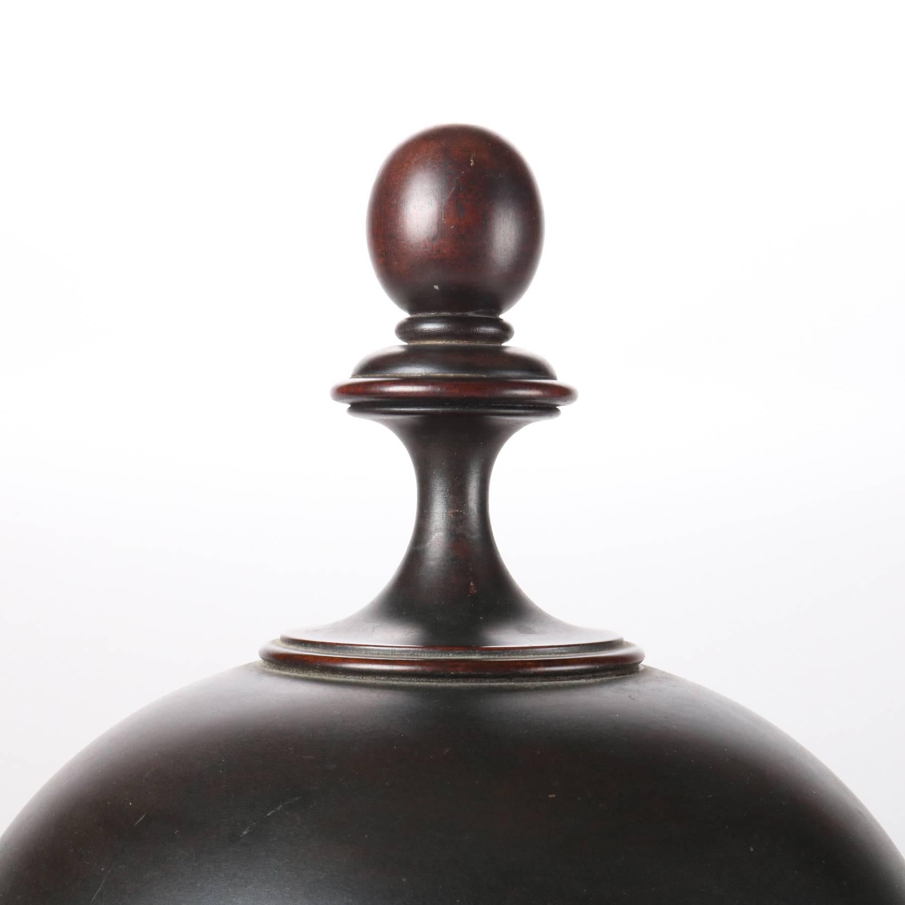 Large antique English Georgian knife caddy features urn form mahogany case on turned pedestal with finial topped lid, accommodates 36 knives, 19th century

Measures: 21