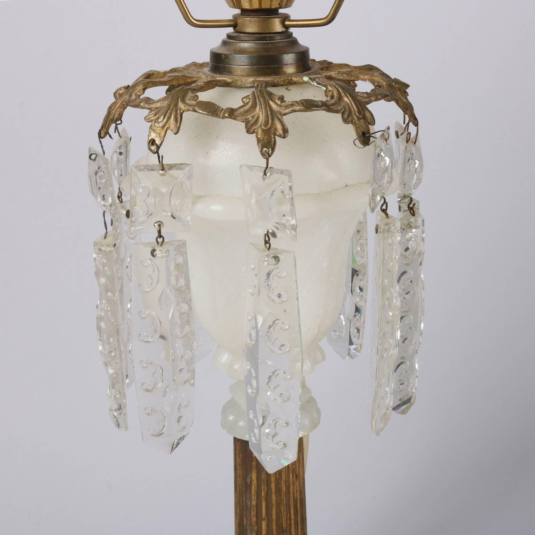 Antique early electrified oil lamp features clambroth font over gilt bronze reeded column on marble base, hanging cut crystals, frosted shade, 19th century

Measures: 21