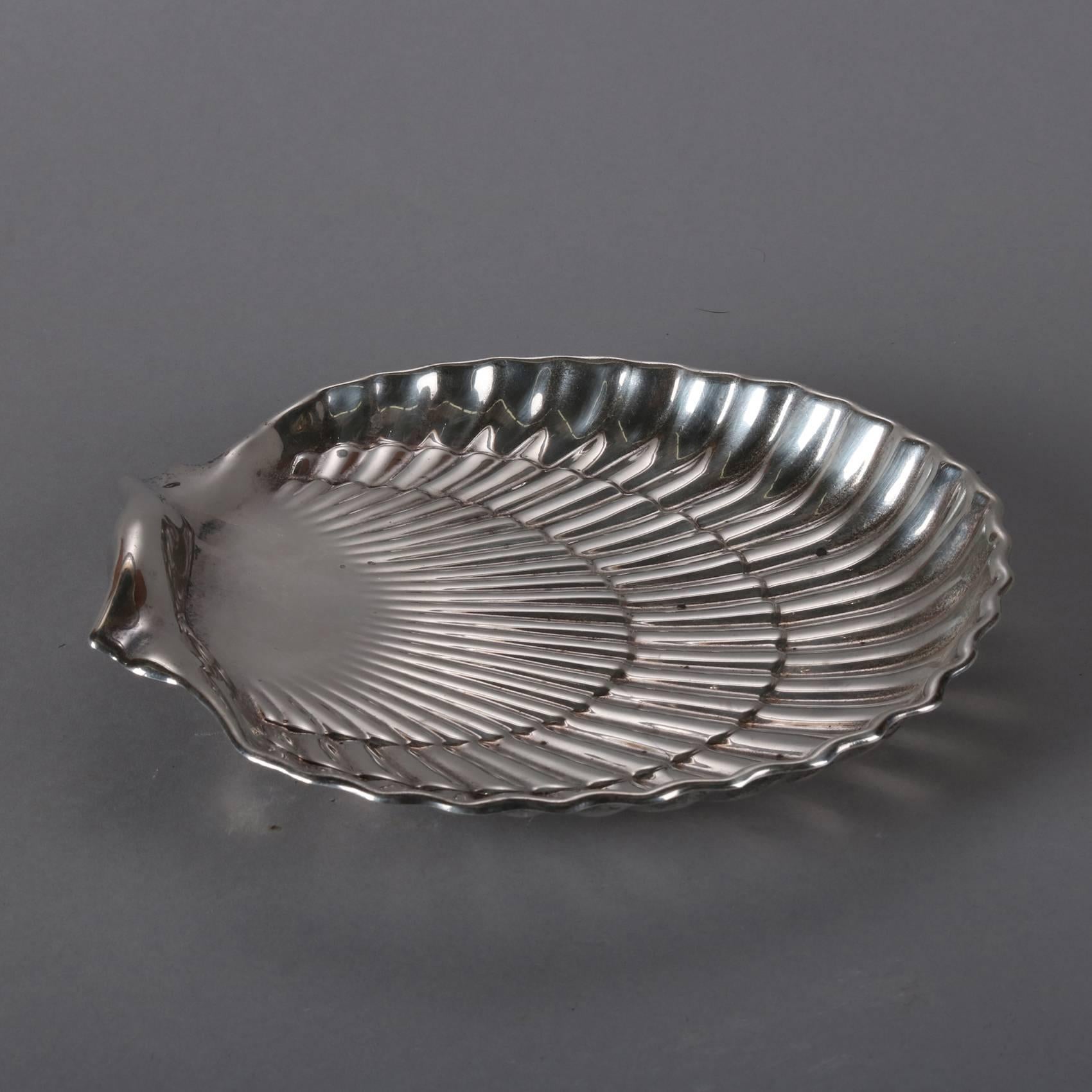 Antique sterling silver dresser tray by Gorham Silver features scallop shell form bowl and is seated on ball feet, hallmarked on base, 15 toz, 20th century

Measures: 1.5