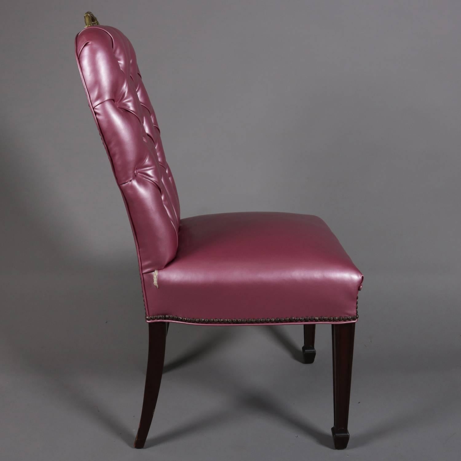 Set of four Hollywood Regency side chairs feature fuschia upholstery with button tuft backs with brass handles, 20th century

Measures: 40