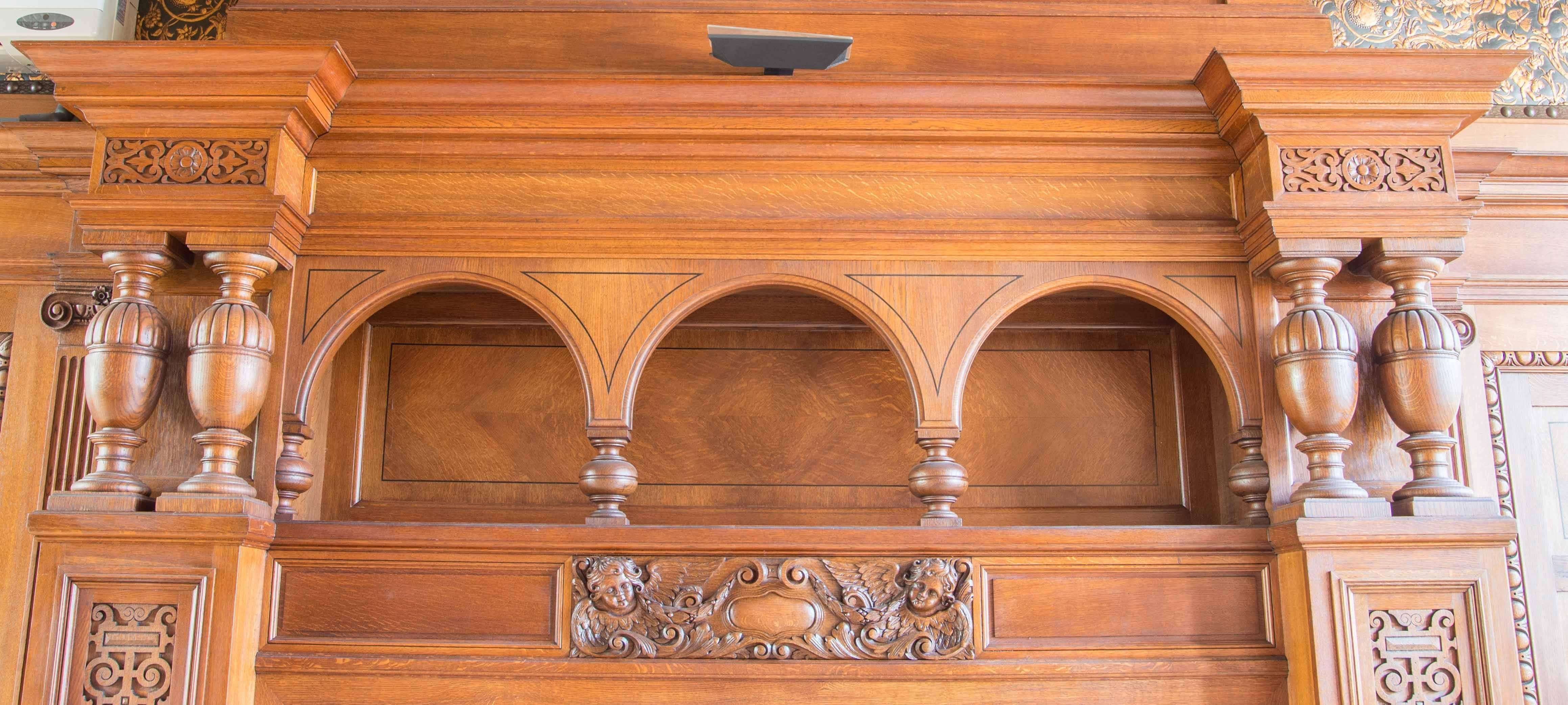 This impressive antique fireplace surround is from Belgium and it dates to the early 1900s. It was salvaged from a chateau in Flanders, Belgium. This is a premium quality surround in excellent condition. It is constructed from solid, quarter-sawn
