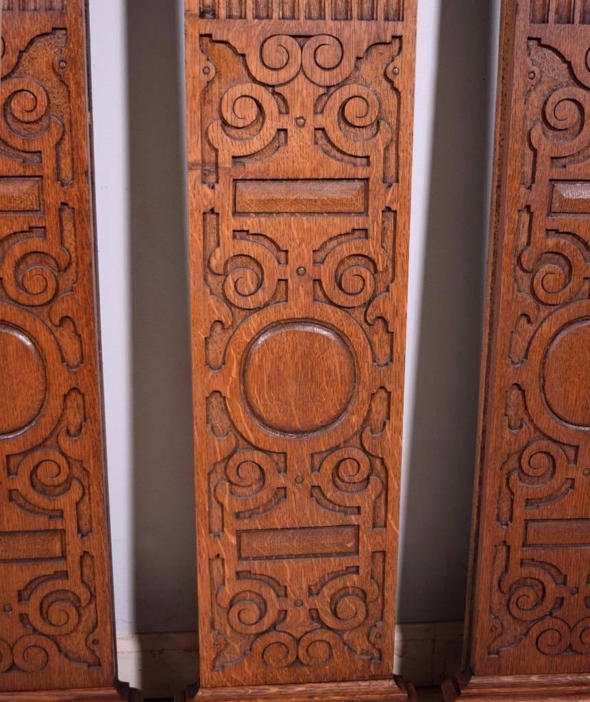 These lovely columns were salvaged from a library in a chateau in Flanders, Belgium. They date to the early 1900s. They are made from solid oak and were originally used as trim pieces between sections of paneling. They are grooved on the edges where