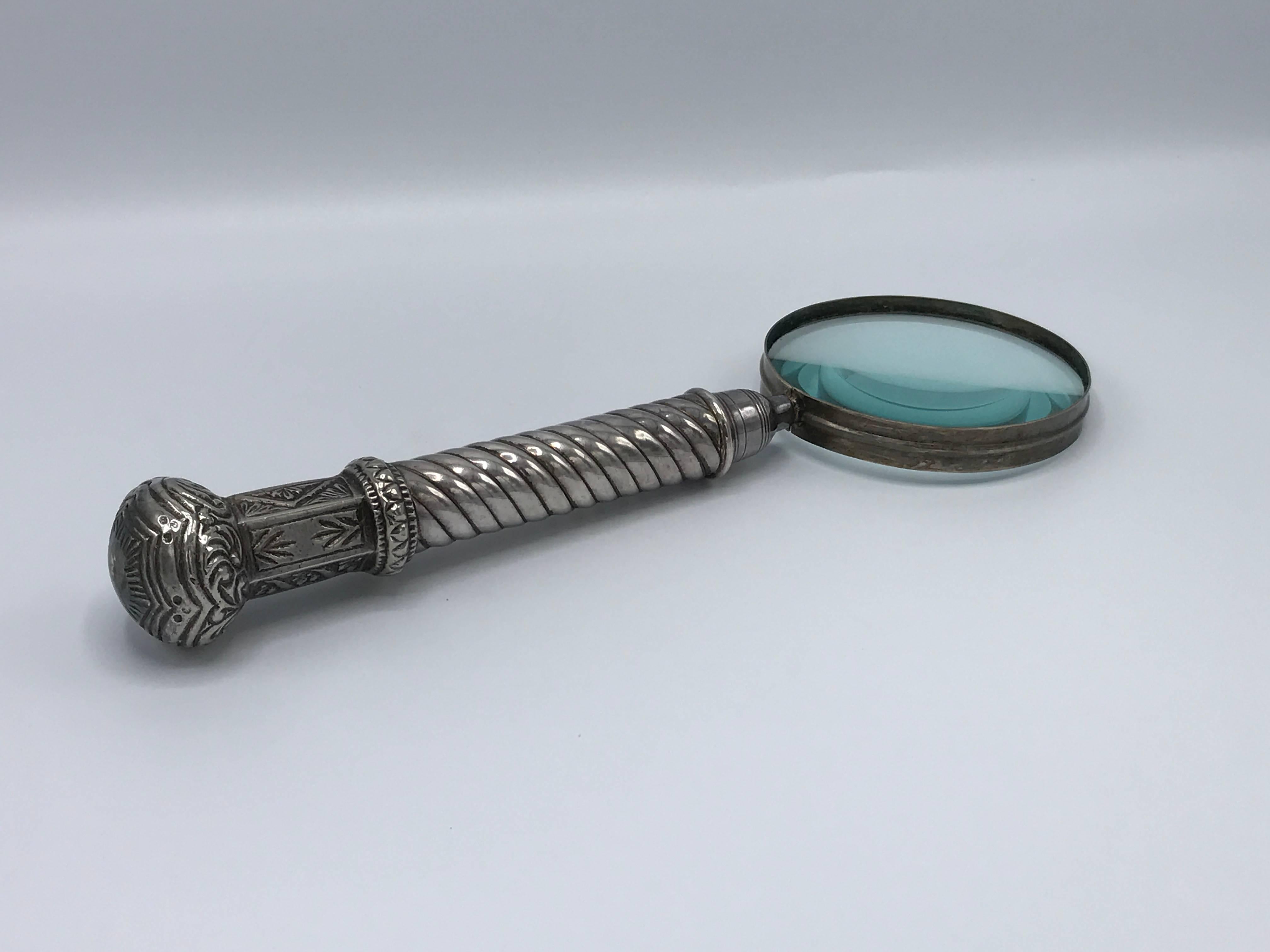 Offered is a gorgeous, 19th century silver plated magnifying glass. Weighted with detailing along the handle.