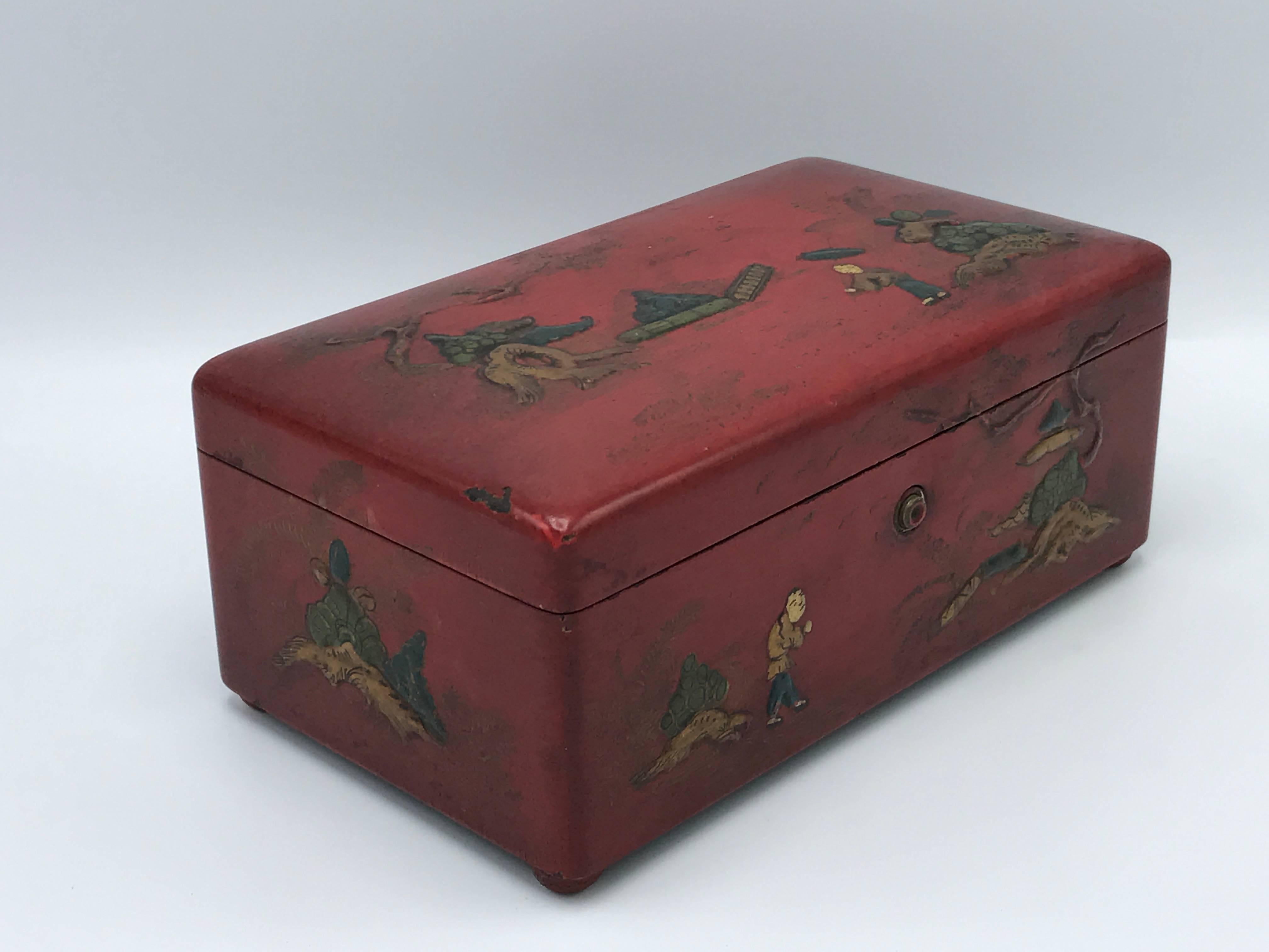 Offered is a stunning, late 19th century, Chinese red lacquered humidor decorative box. In the ornate design, each figure has raised faces. Working locking mechanism and hinges.