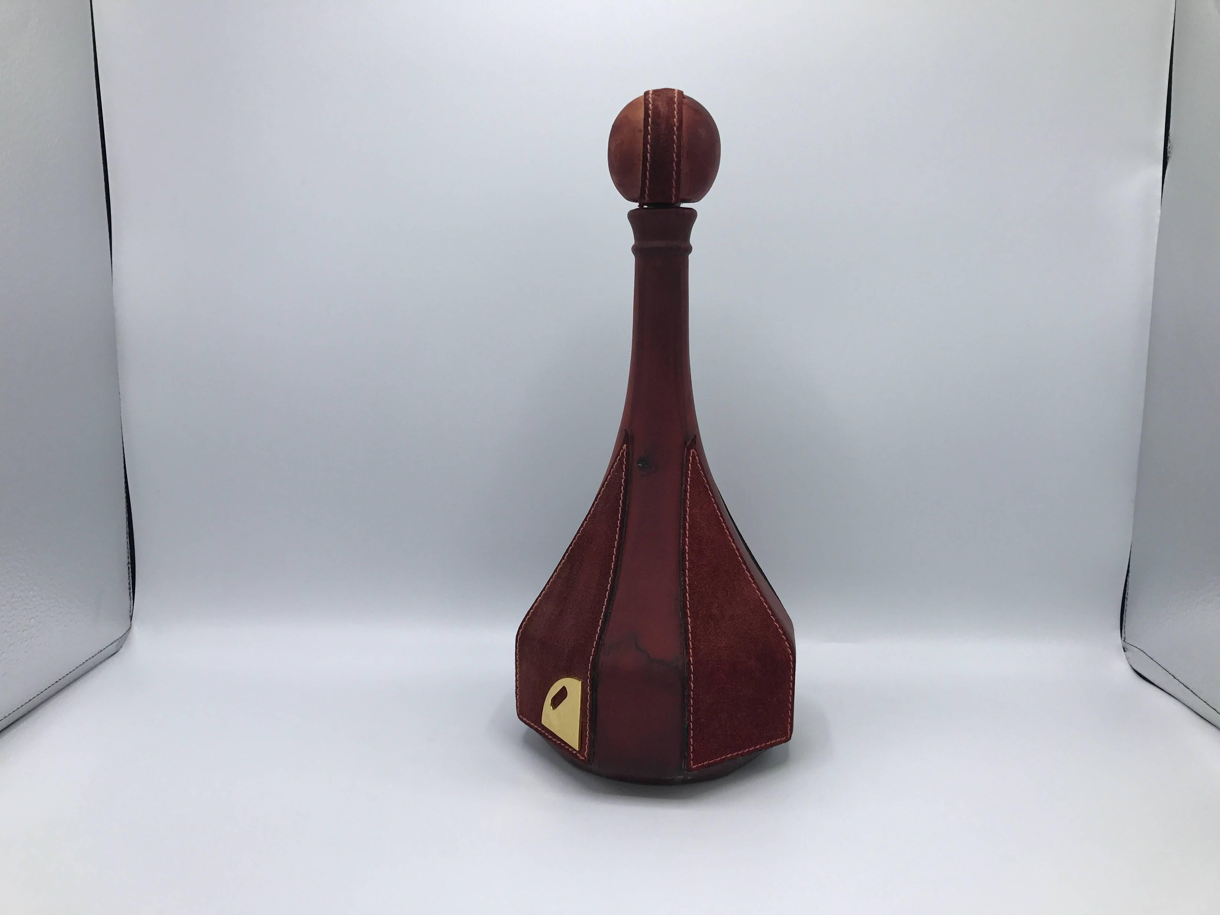 Offered is a modern and sophisticated, 1970s Italian red leather and suede decanter. Marked on brass plate, backside.