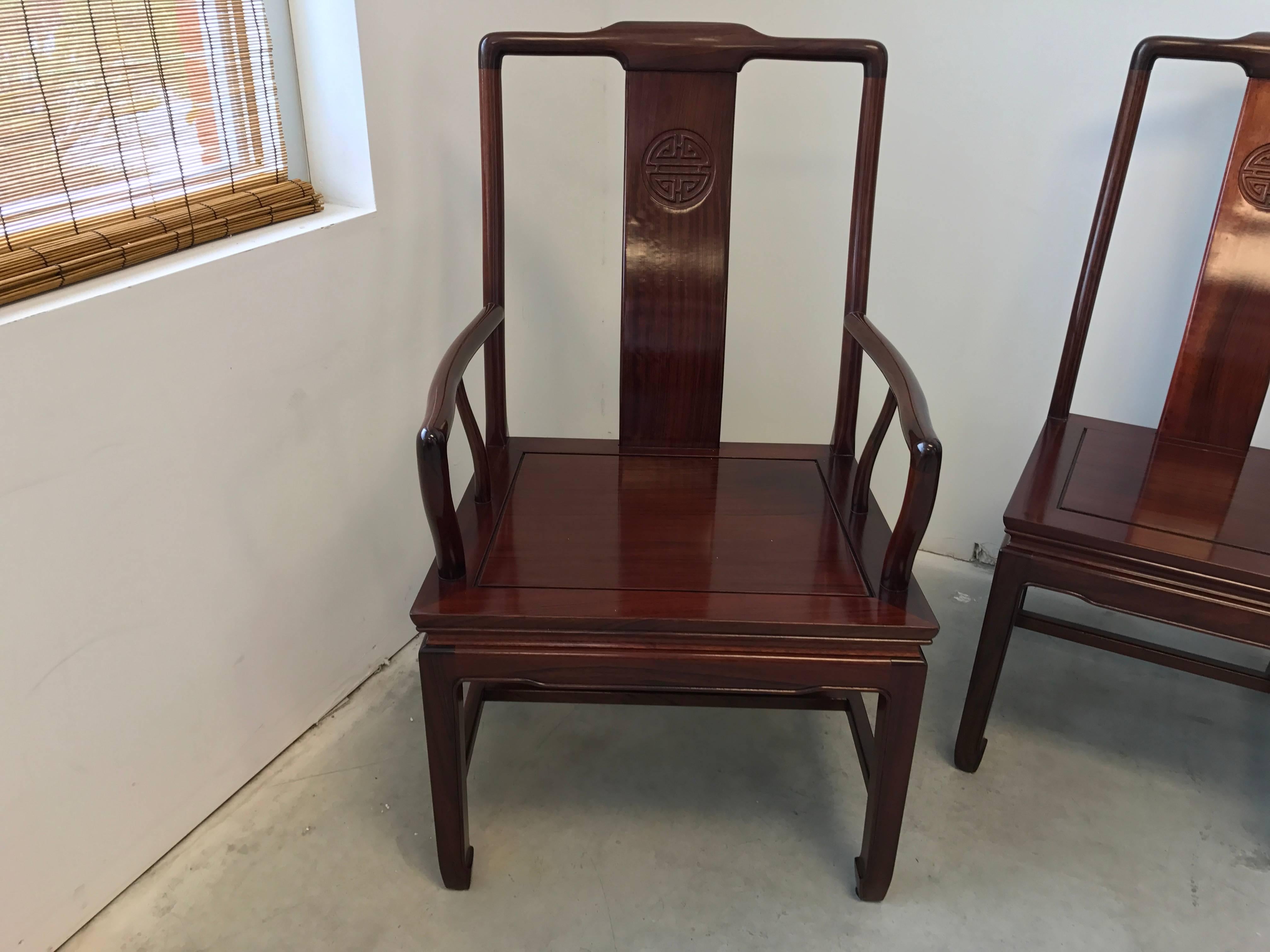 Offered is a gorgeous, set of six, 1960s Ming style rosewood dining chairs. Includes seat cushions, foam and fabric are in excellent condition.

Measures: Armchairs (two) 19