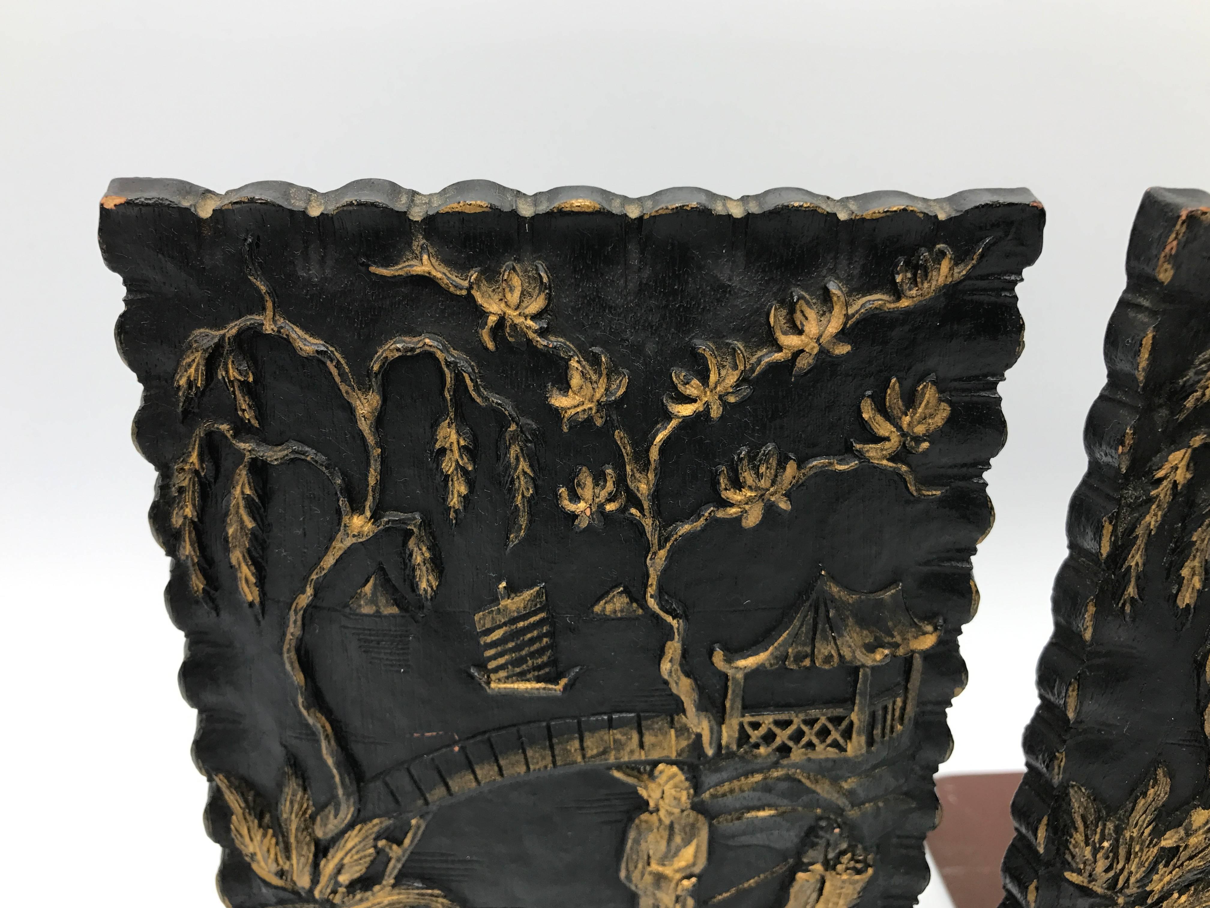 Offered is a gorgeous pair of 1920s, black and gold Asian bookends. The material seems to be a hardened leather with gilt accents.