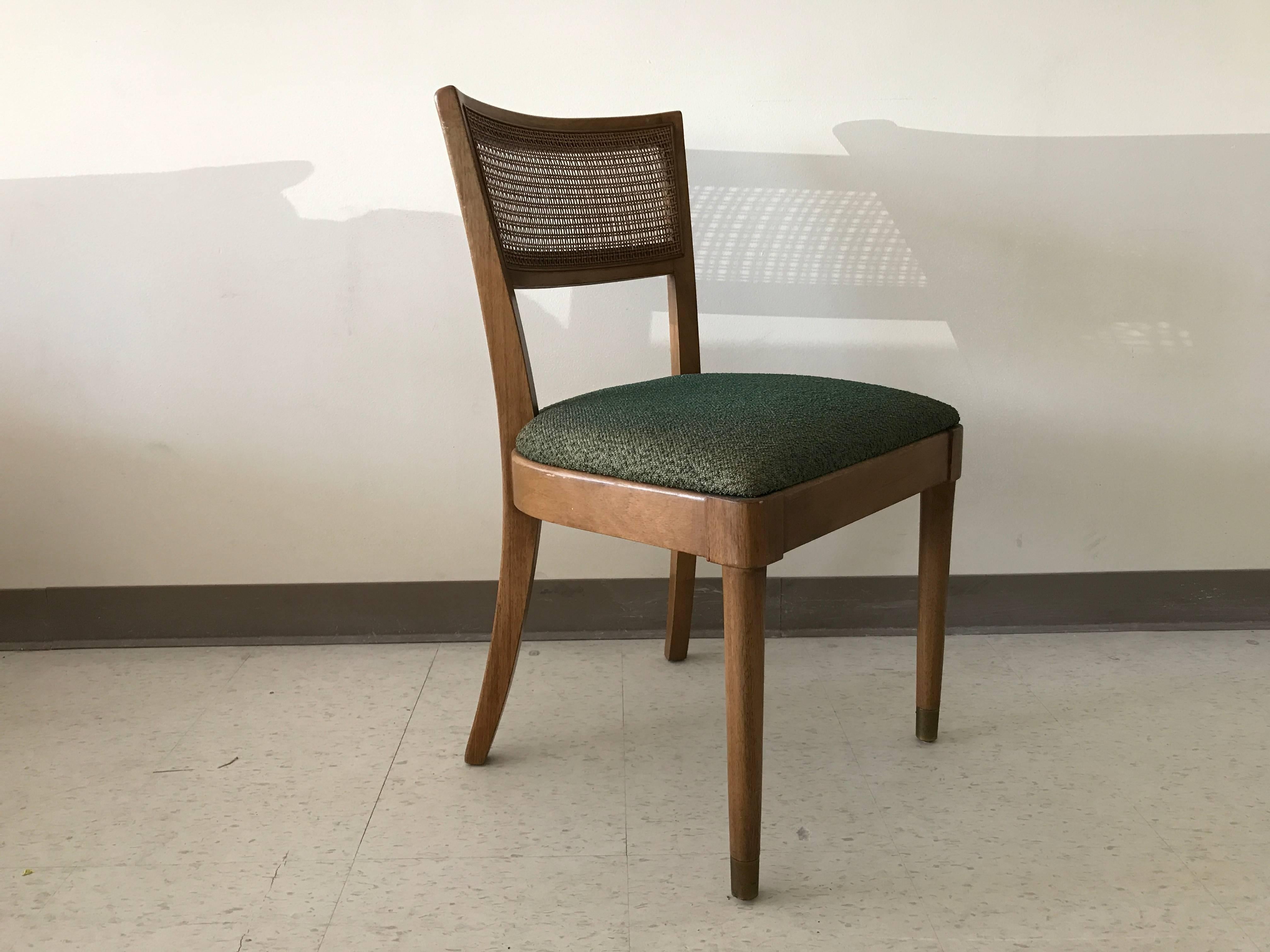 Offered is a stunning set of six, 1960s Drexel walnut dining chairs. Each chair has a cane upper backing, original green fabric, and brass feet cap.