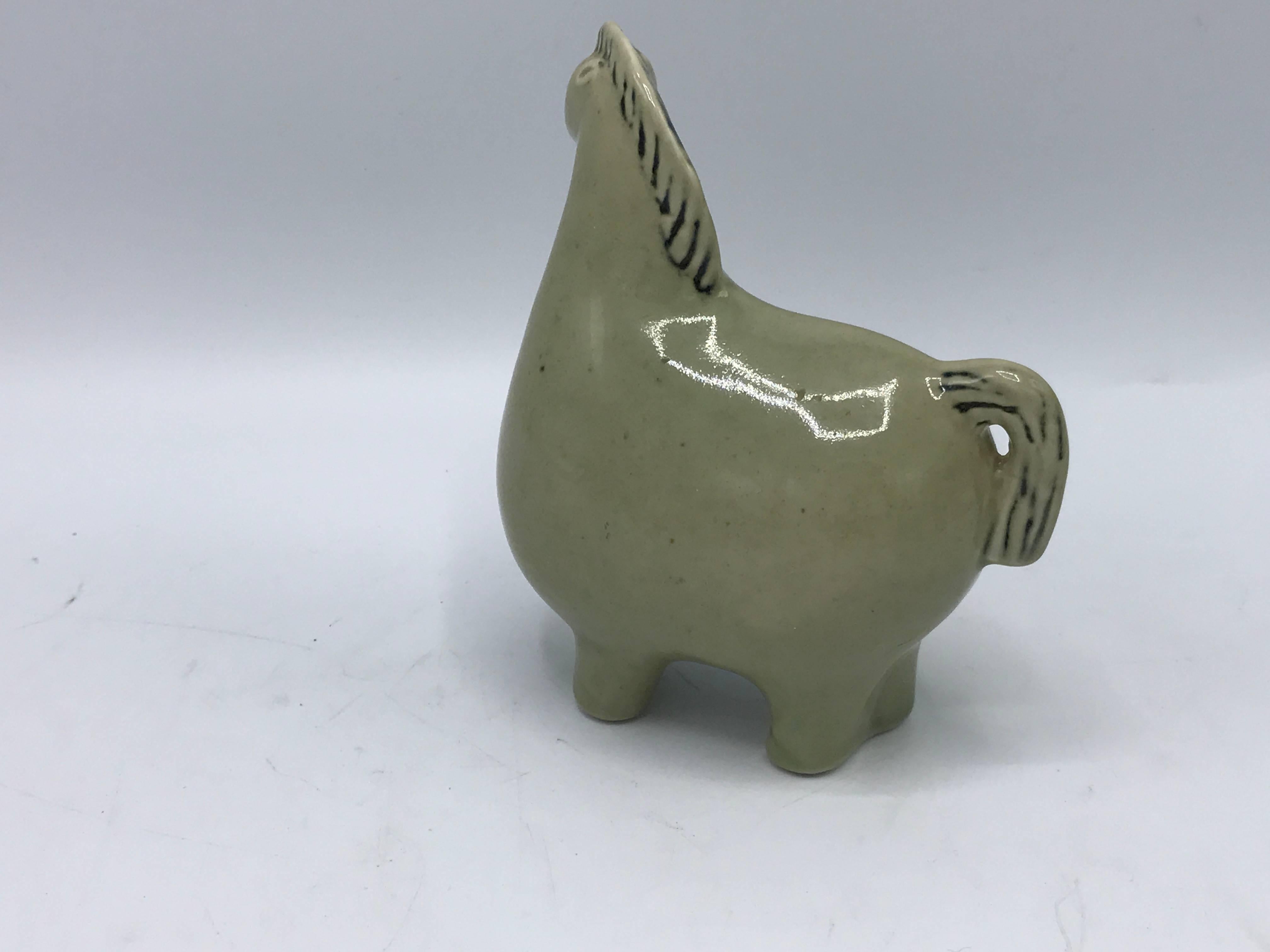 Offered is a stunning and rare, 1950s Stig Lindberg green glazed-ceramic horse sculpture. Marked on underside with original sticker and stamp.