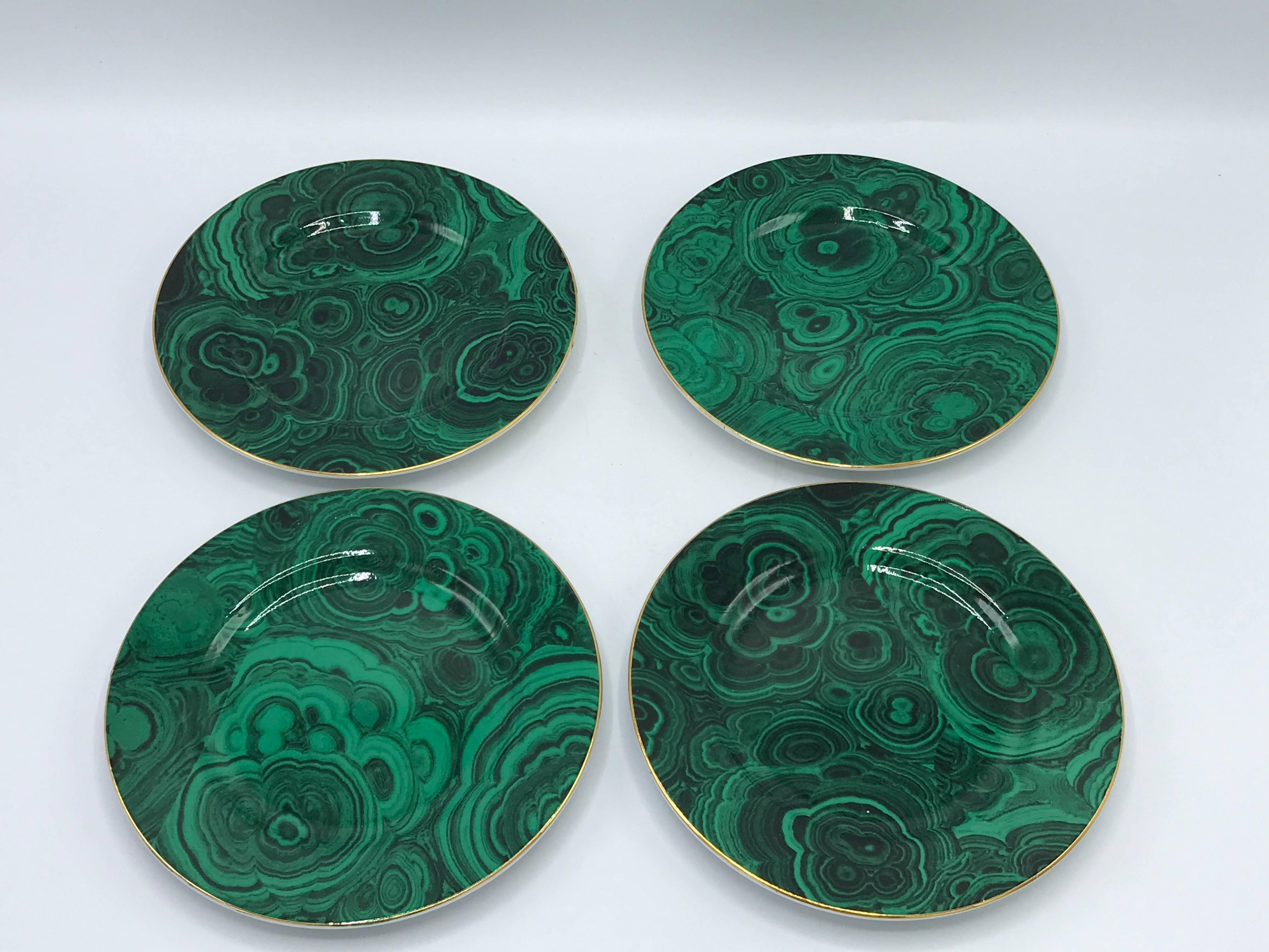 Offered is a stunning set of four, 1980s Neiman Marcus malachite dessert plates with a gold 24-karat band around the perimeter. Marked on underside.