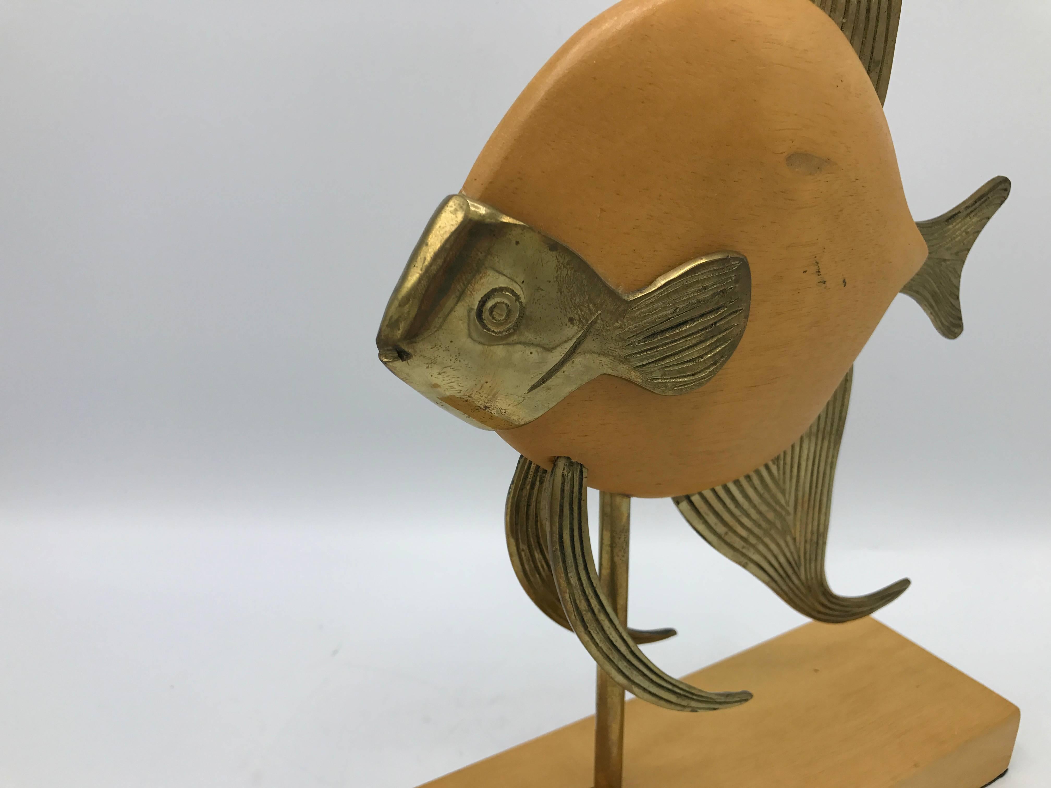 Offered is a beautiful, 1970s Sarreid style brass and wood mounted fish sculpture.