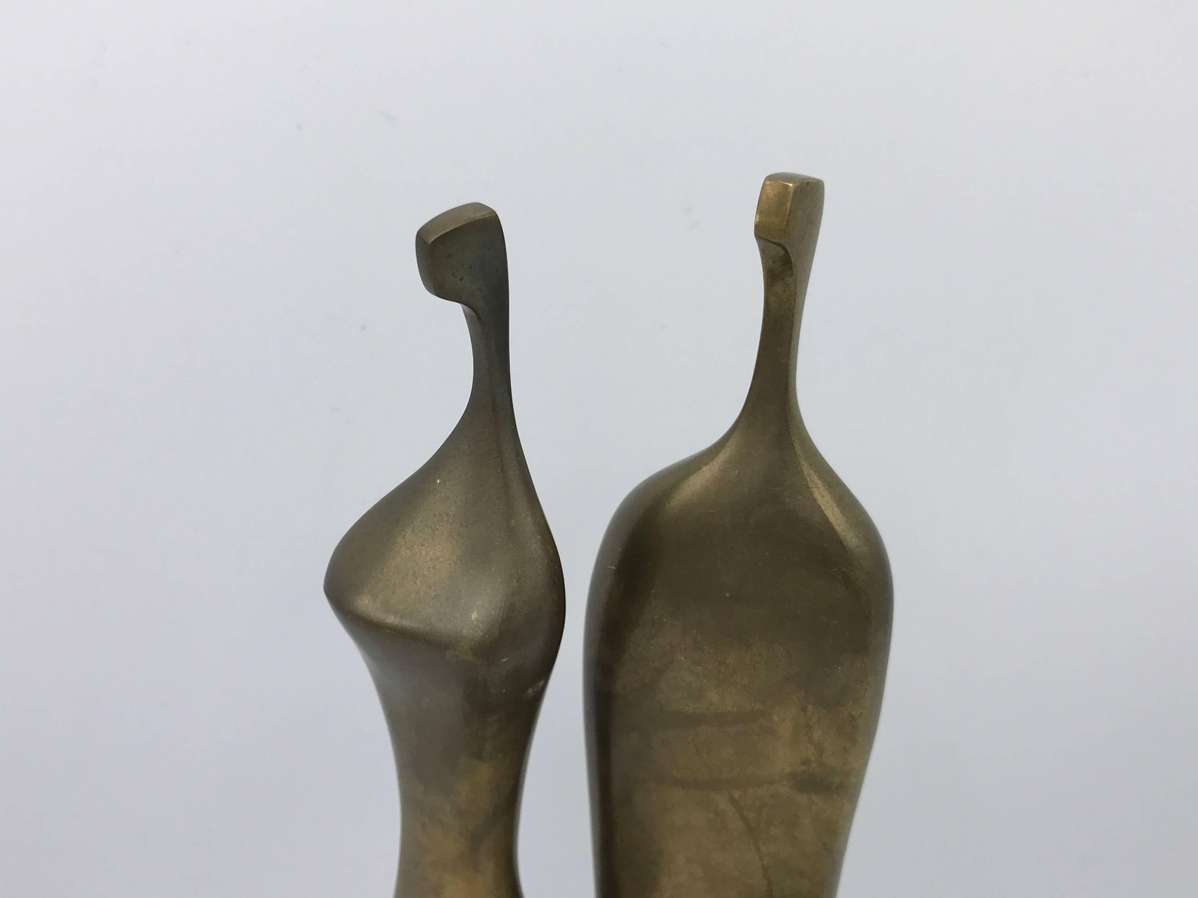Offered is a stunning, pair of 1970s Itzik Ben Shalom modernist bronze male and female sculptures. Each are marked 11 of 500. Hand-crafted in 1978.