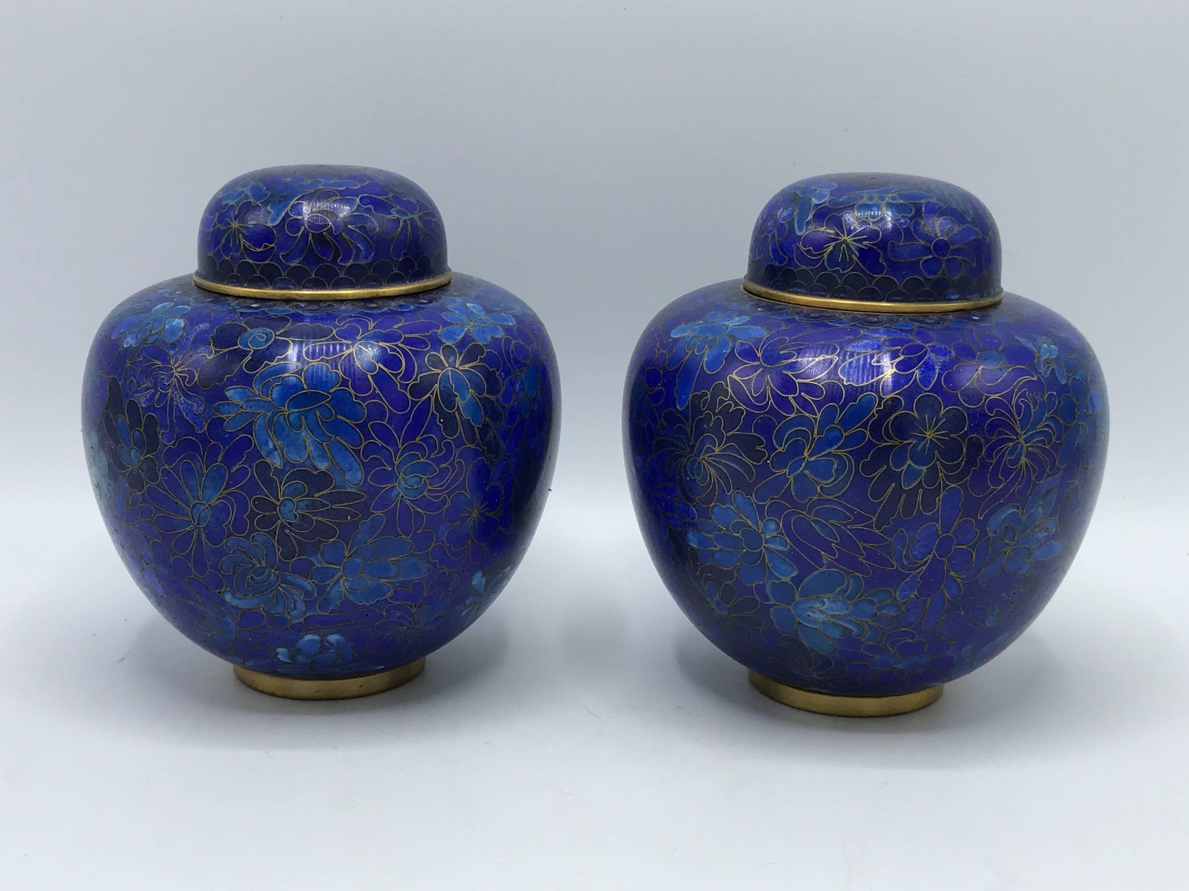 Offered is a stunning pair of 1960s cloisonńe ginger jars. Cobalt blue with a floral motif.