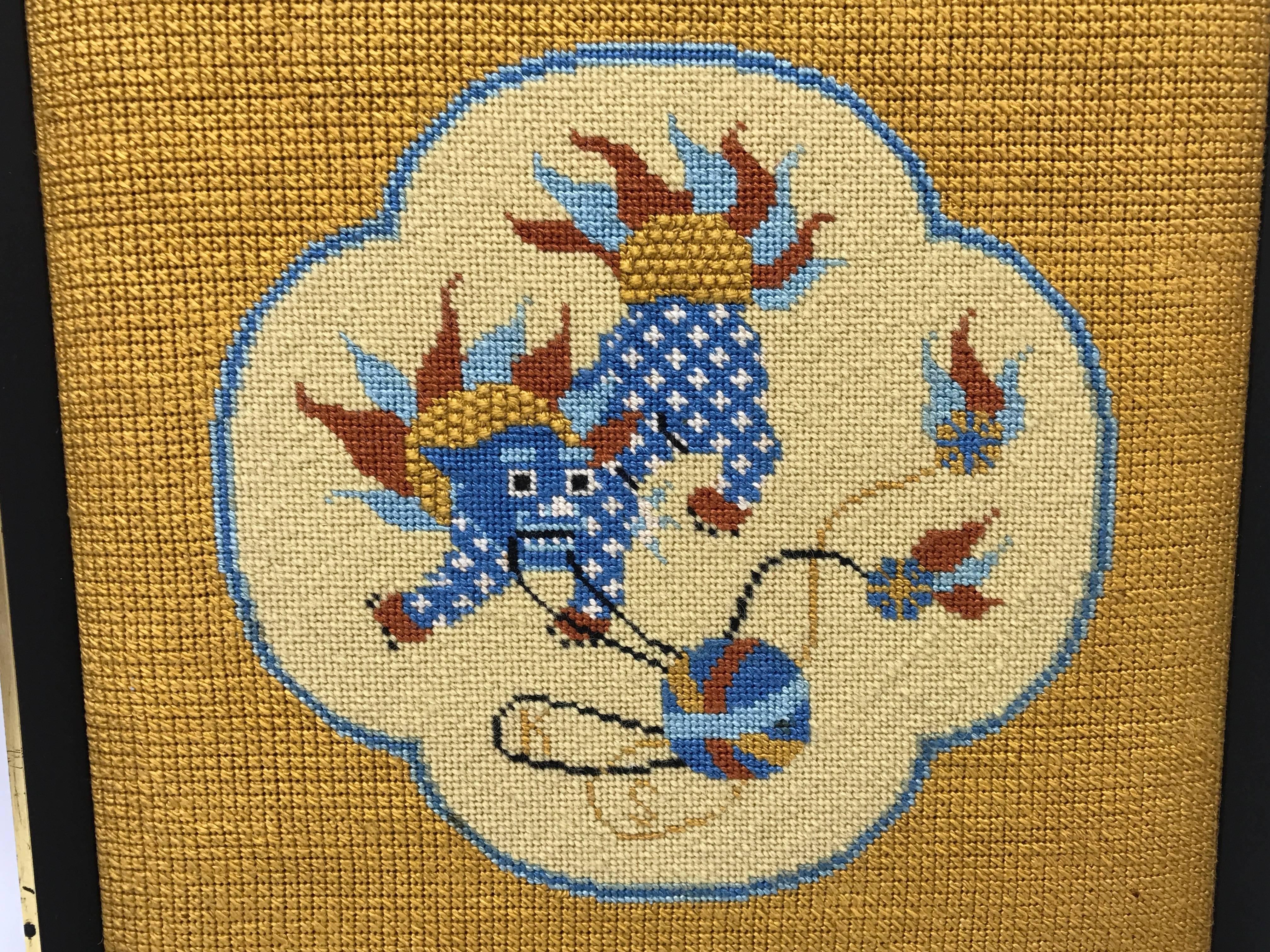 Offered is a stunning, 1960s framed needlepoint of a playful foo dog. Could easily be taken out of the frame and turned into a pillow. 