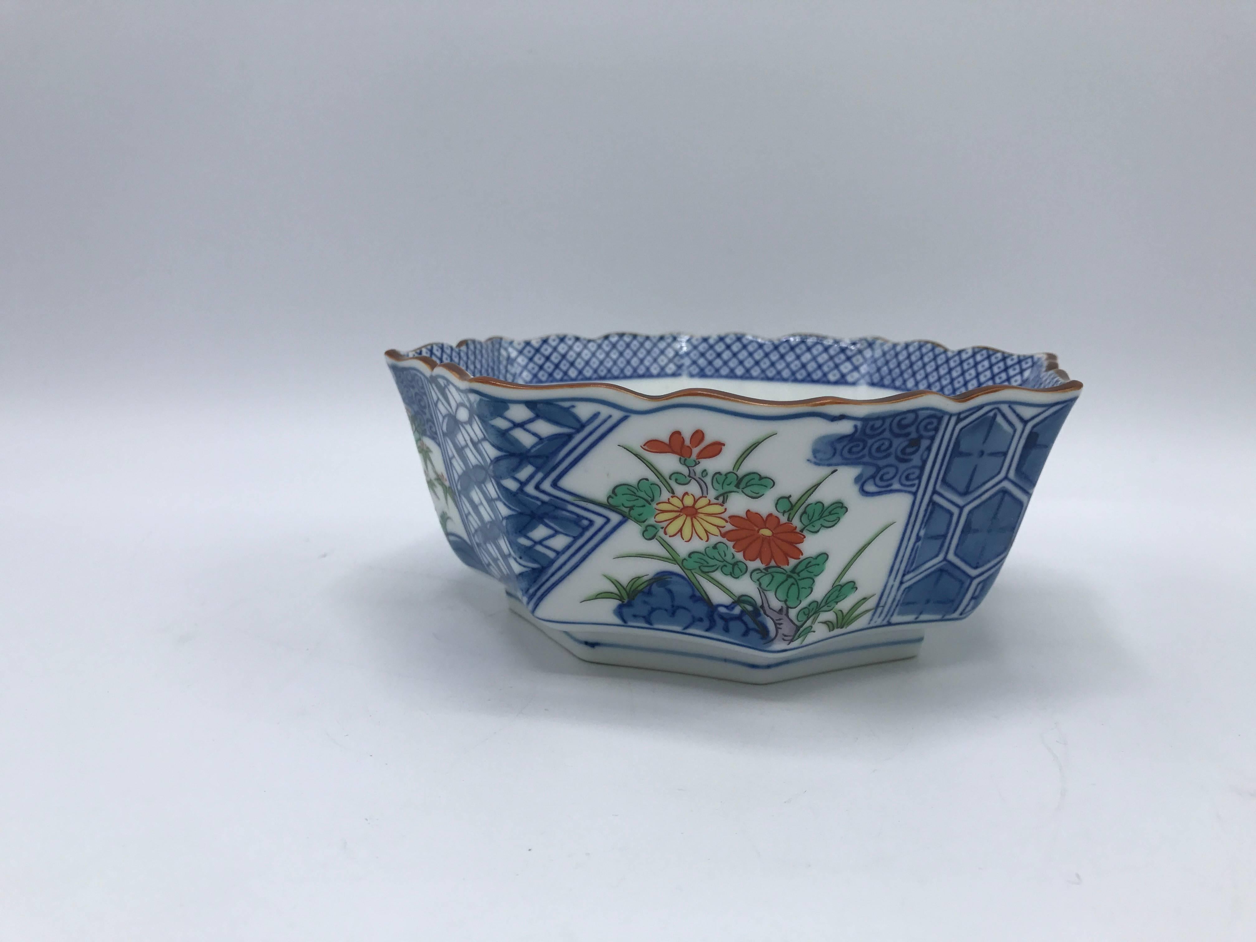 Offered is a gorgeous, 1980s Tiffany & Co. blue and white chinoiserie bowl with a hand-painted floral and bamboo motif.