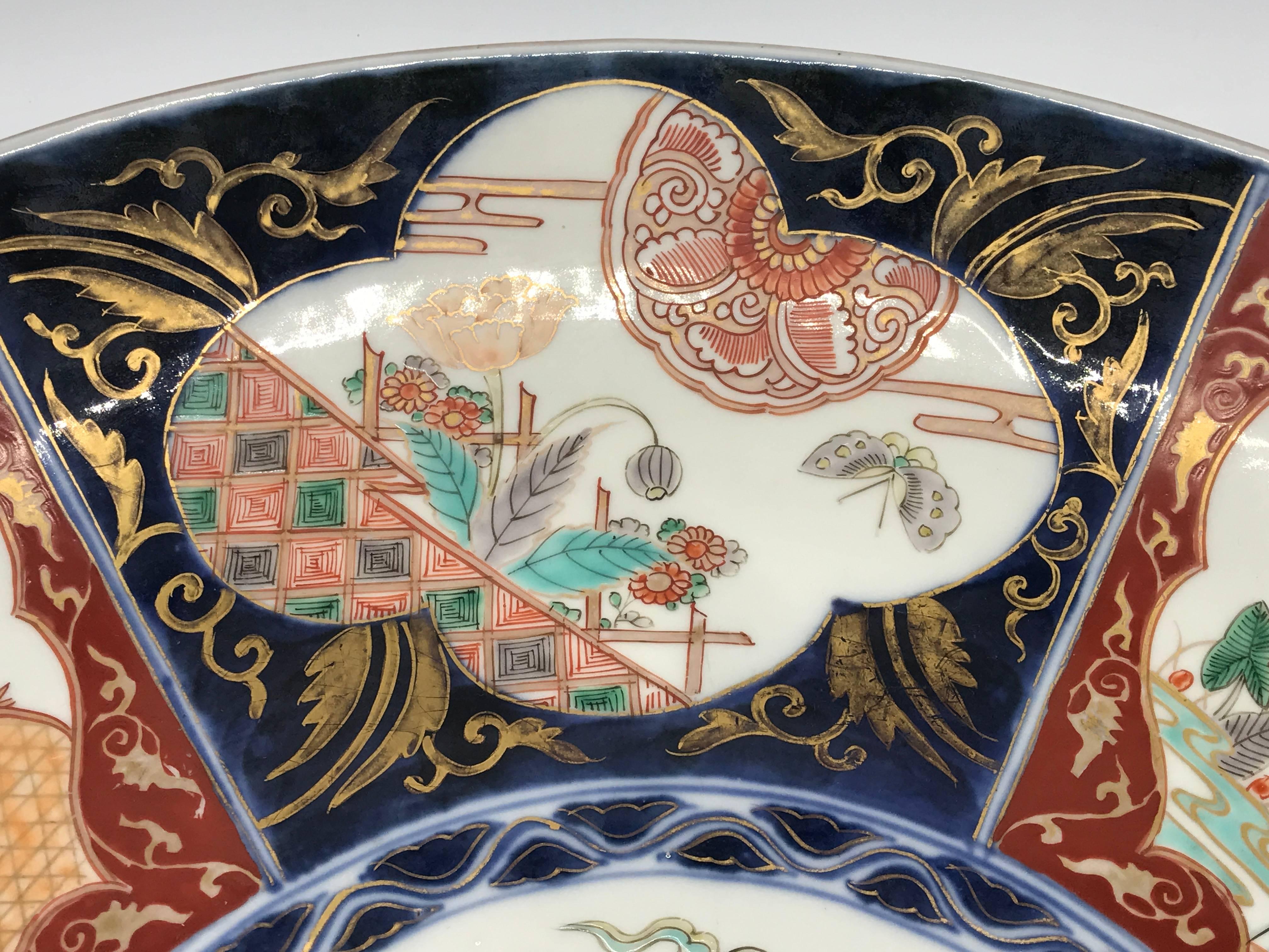 Offered is a gorgeous, 19th century Imari polychrome charger plate. Six alternating scenes with a large dragon in the center.