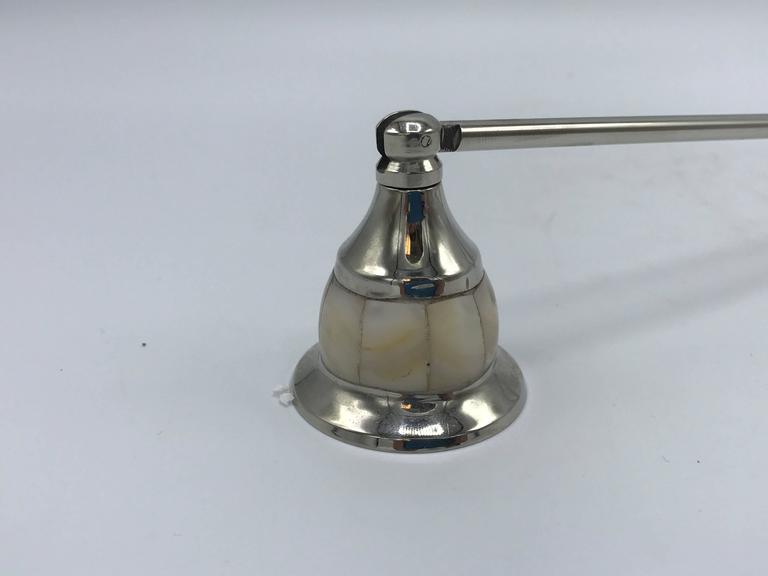 Offered is a beautiful, 1960s mother-of-pearl inlay candle snuffer. Looks like it has never been used.