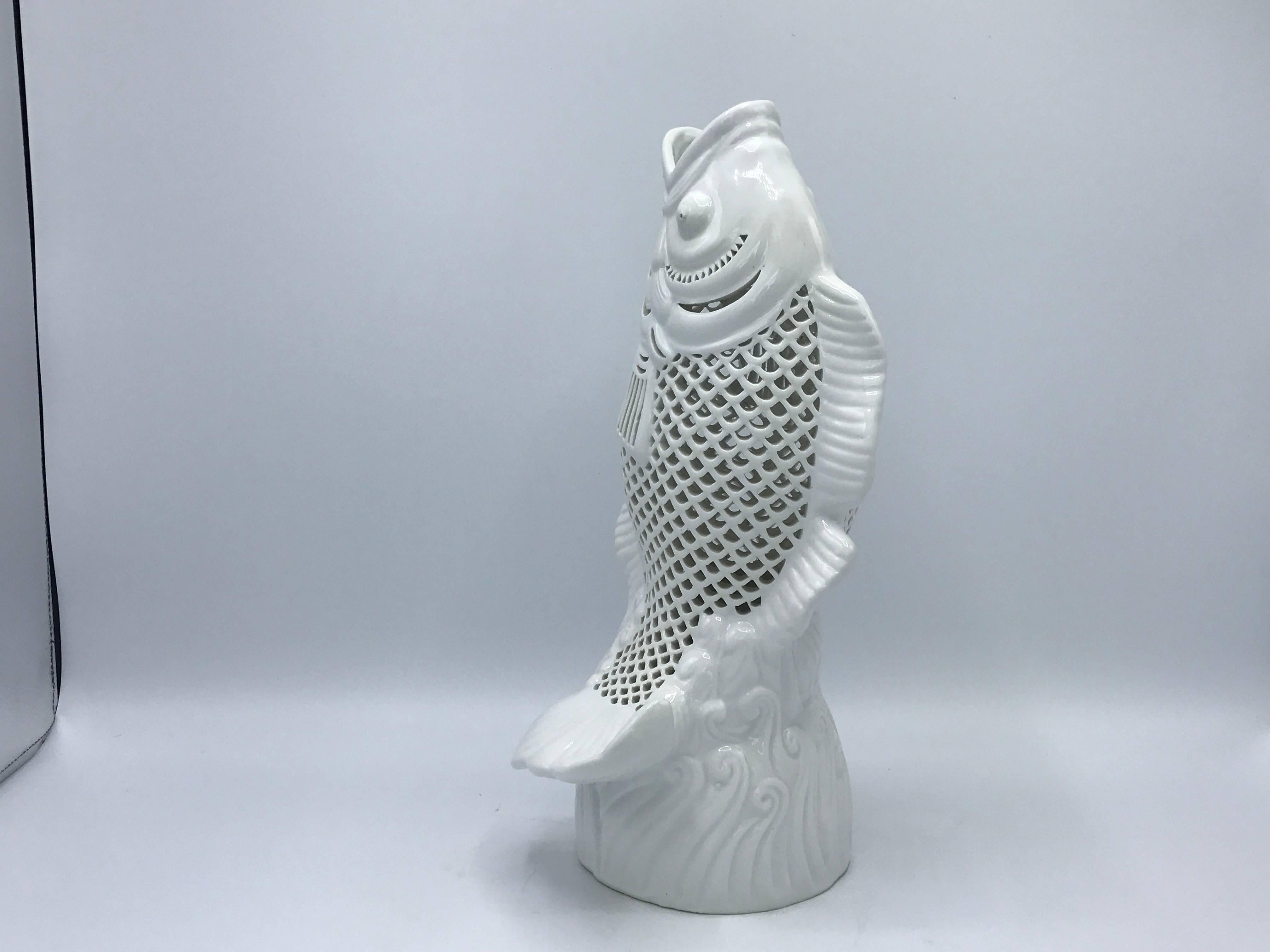 Offered is a fabulous, 1960s Blanc de Chine koi fish sculpture. Pure white porcelain. Pierced along the scales. Small holes underneath, allowing it to easily be converted into a lamp.