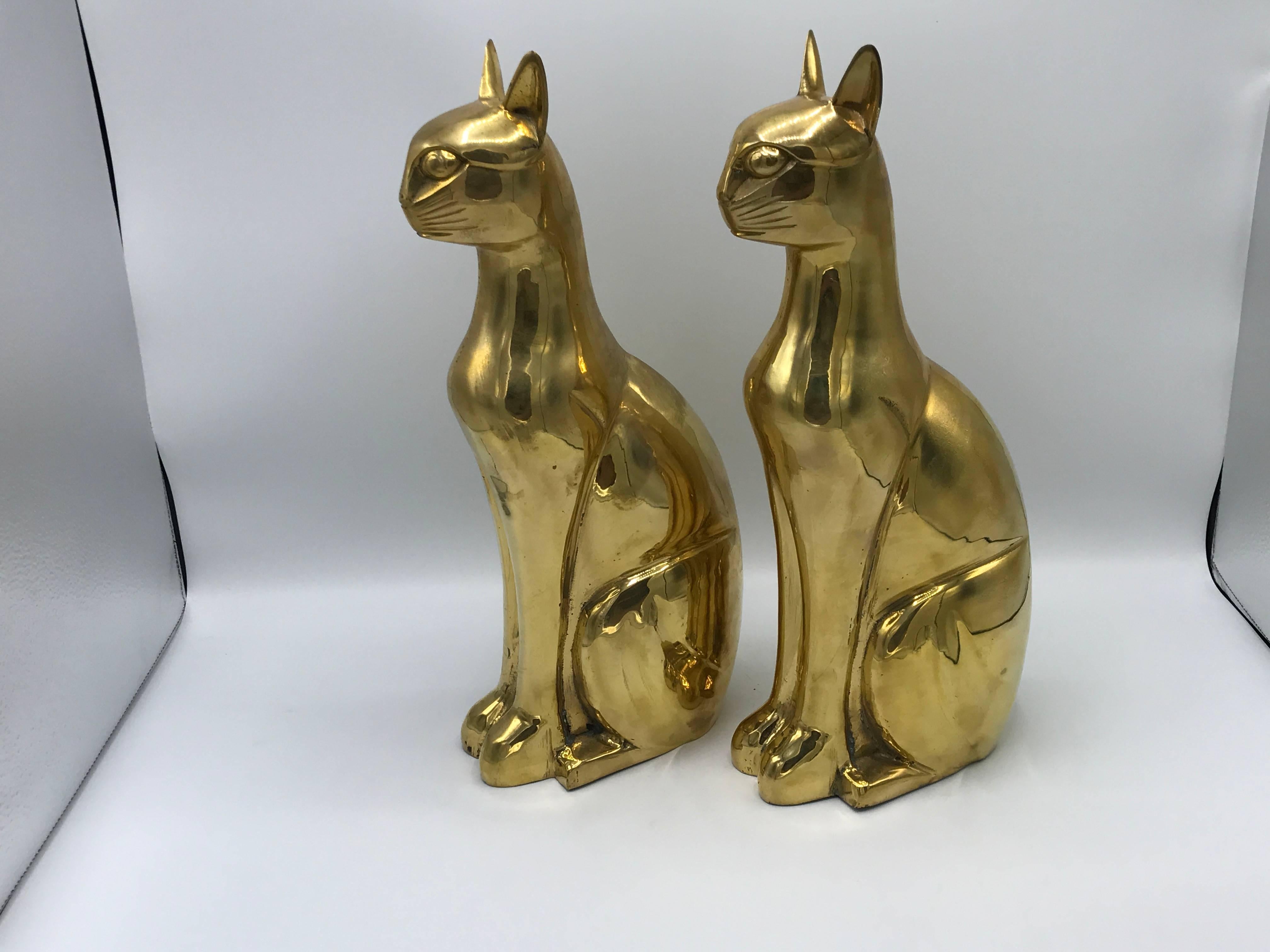 Offered is a gorgeous, pair of 1960s Italian brass cat sculptures. Heavy, even though the pair are hollow inside. Thick brass.