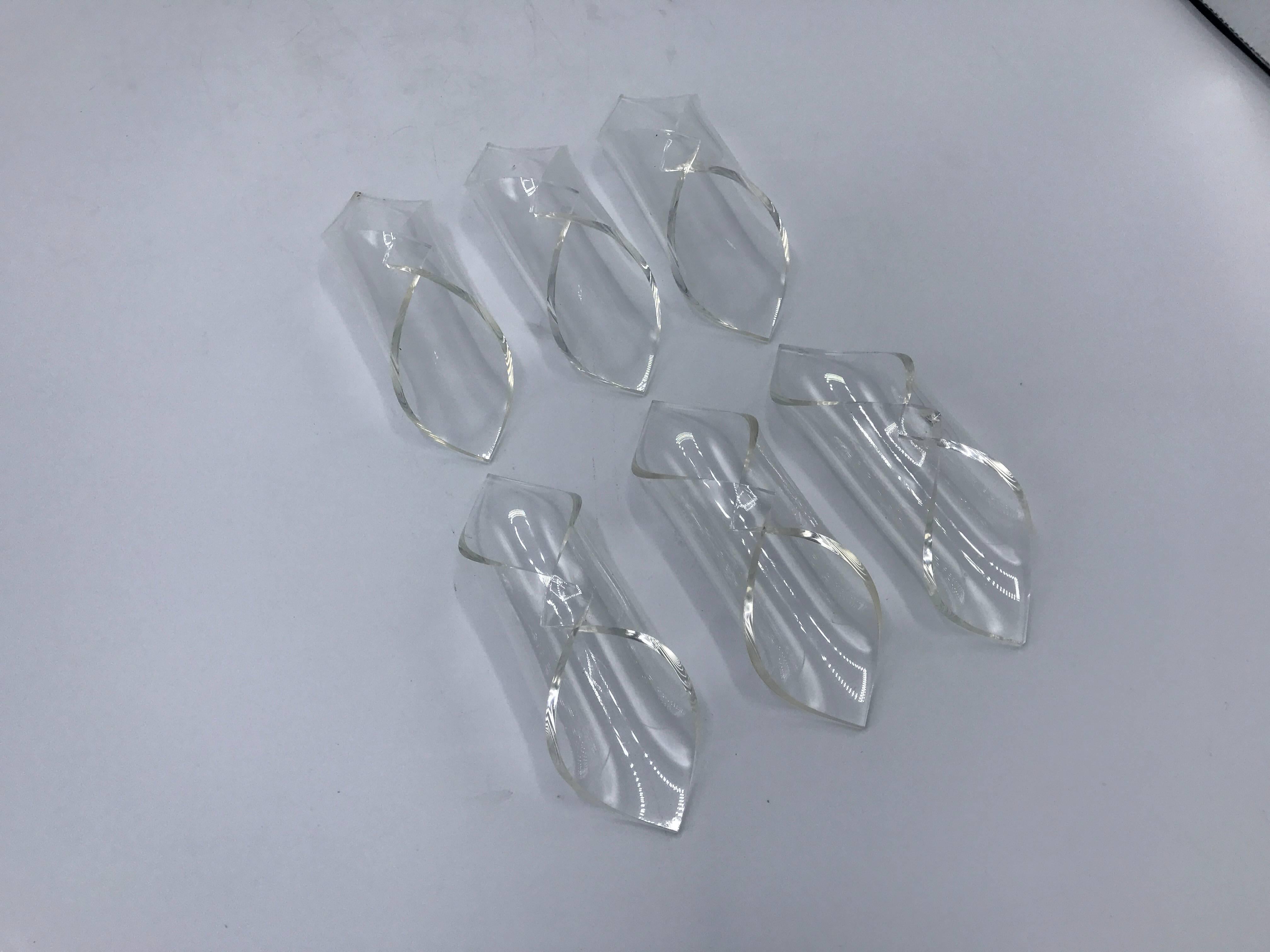 Offered is a stunning, set of six, 1960s Lucite napkin rings.