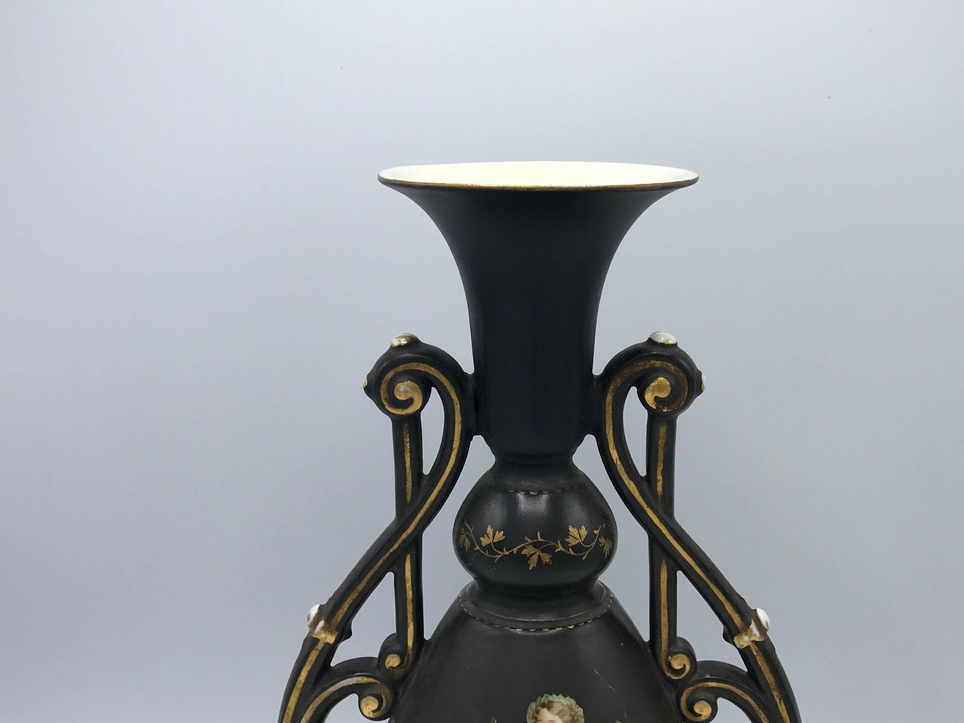 Offered is a gorgeous, 19th century French vase with handles. Hand-painted black with hand-painted gold accents. Woman on front side.