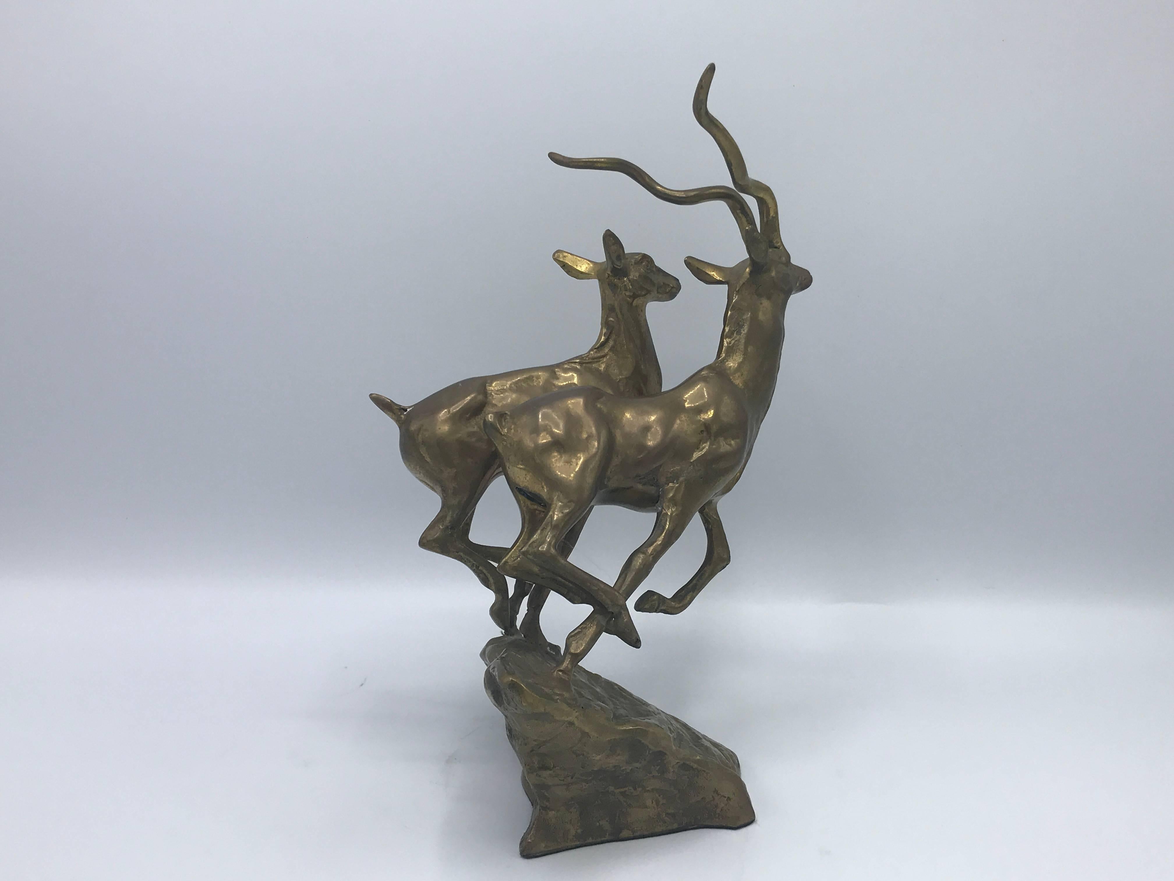 Offered is a beautiful, 1960s brass running kudu antelope sculpture. Male and female.