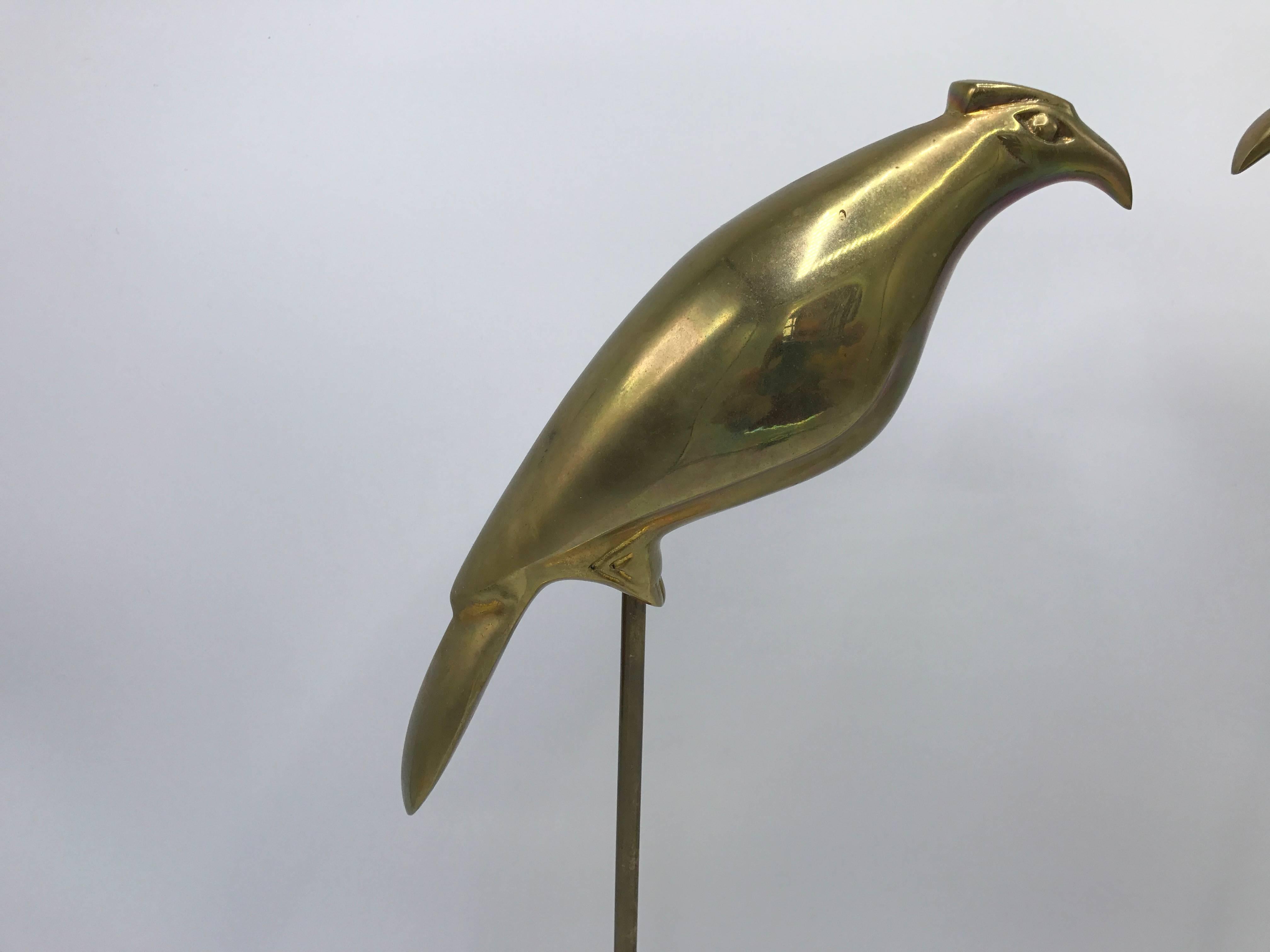 Offered is a fabulous, pair of 1960s Italian brass parakeet bird sculptures. Each bird is mounted to a heavy, solid-brass stand.