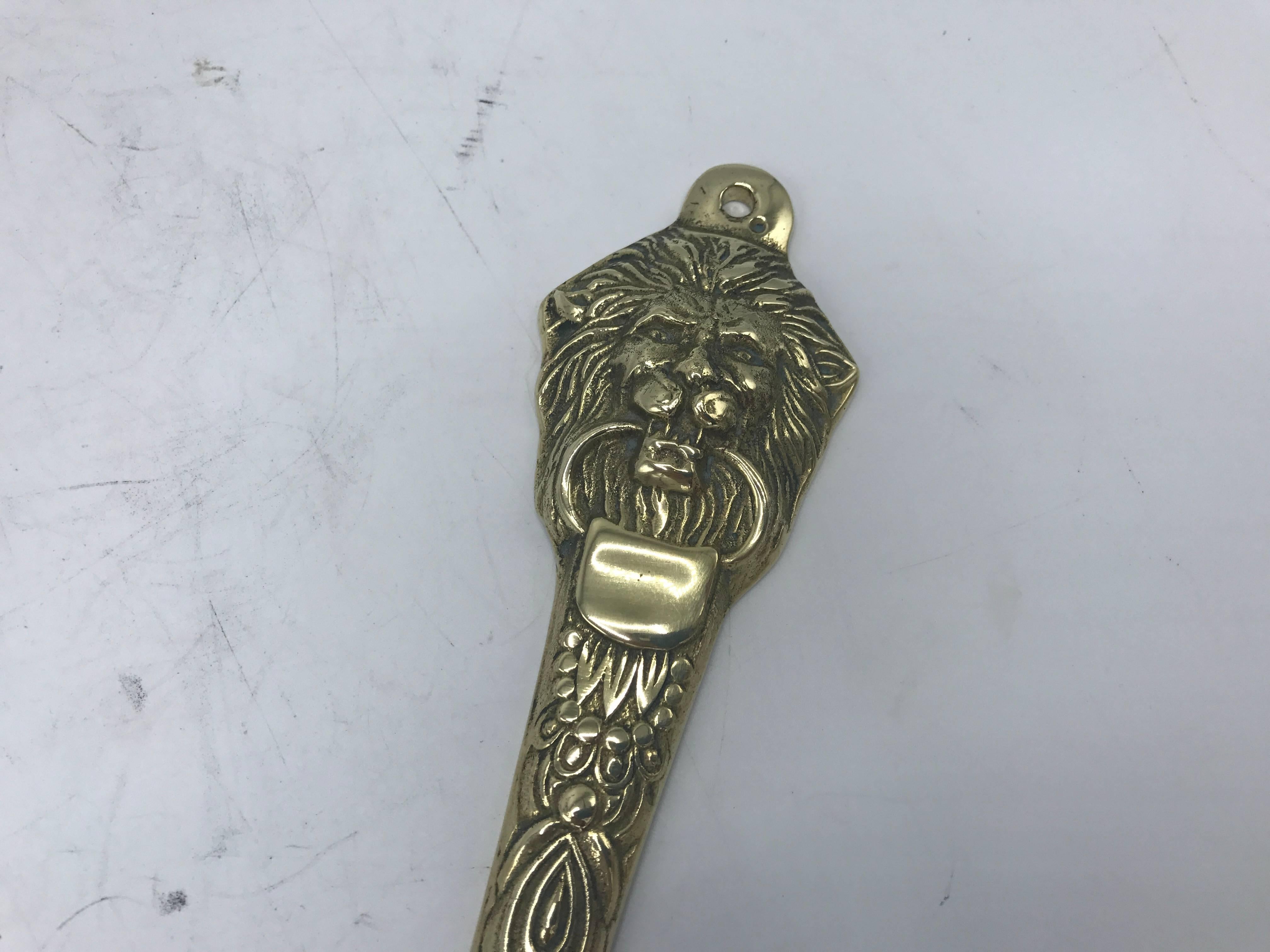 Offered is a gorgeous, 1960s solid-brass lion head motif shoe horn.