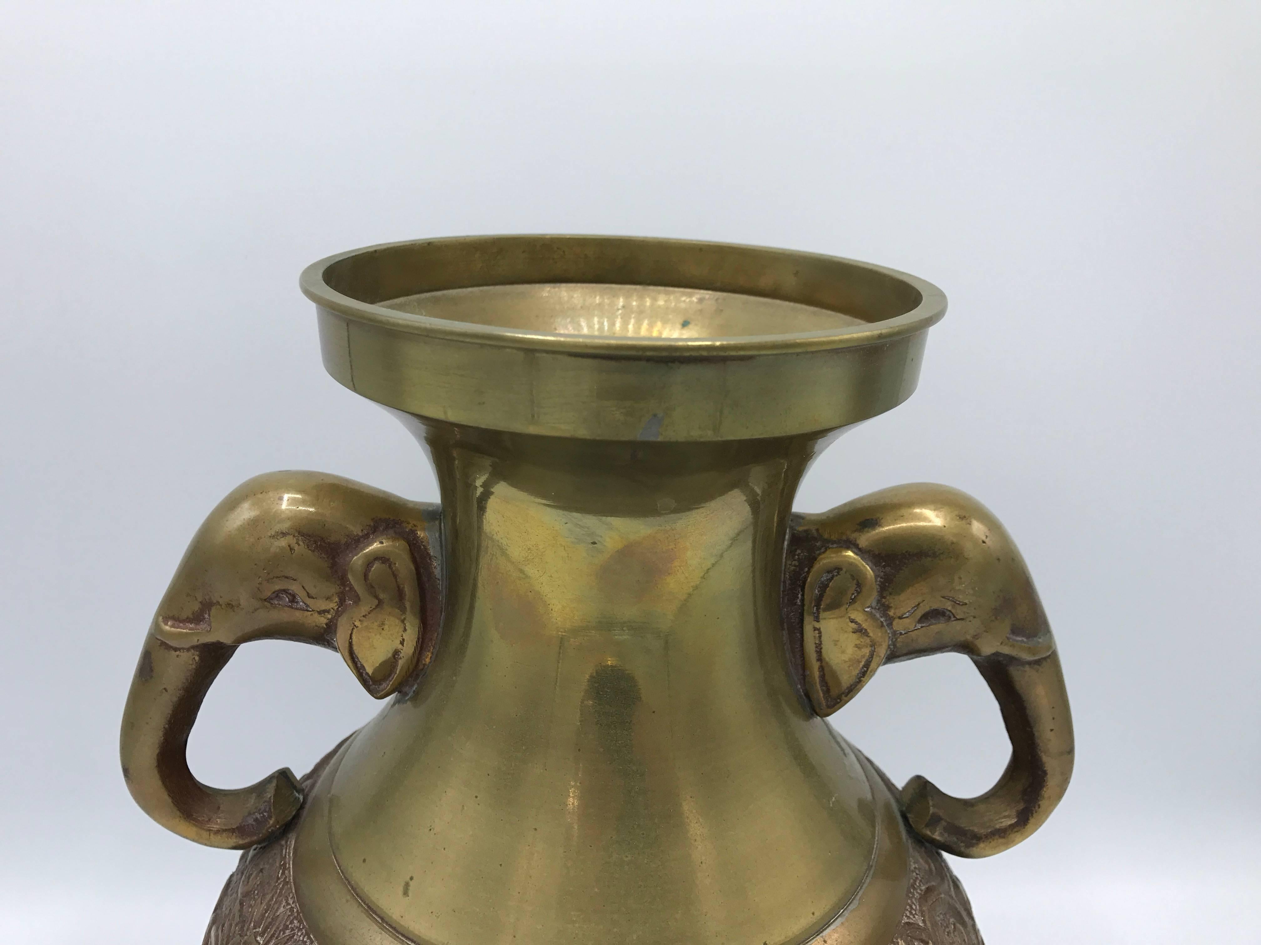 Offered is a gorgeous, 1970s brass urn with elephant handles. Heavy.