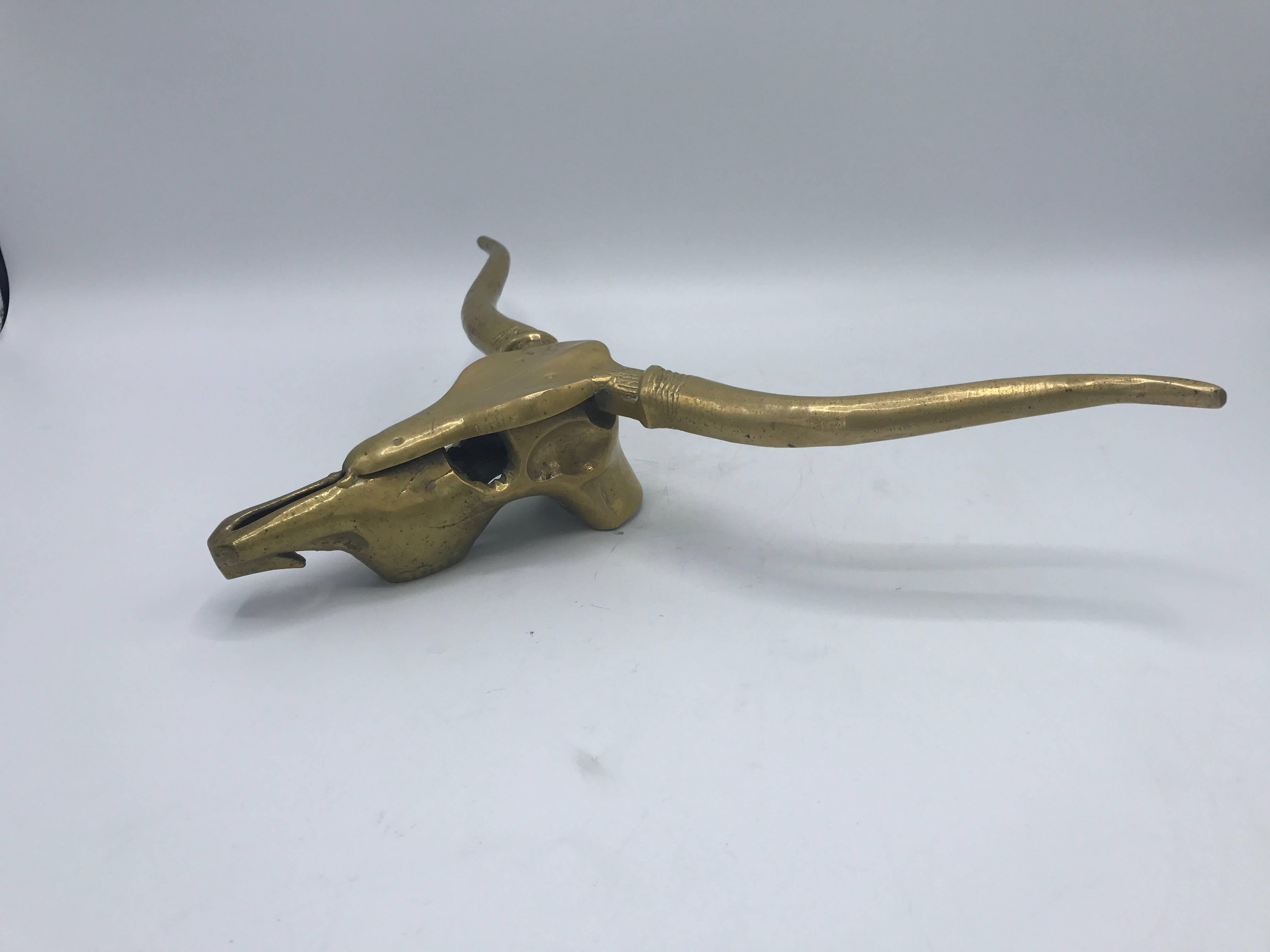 Offered is a beautiful, 1960s solid-brass cow skull hanging wall sculpture.