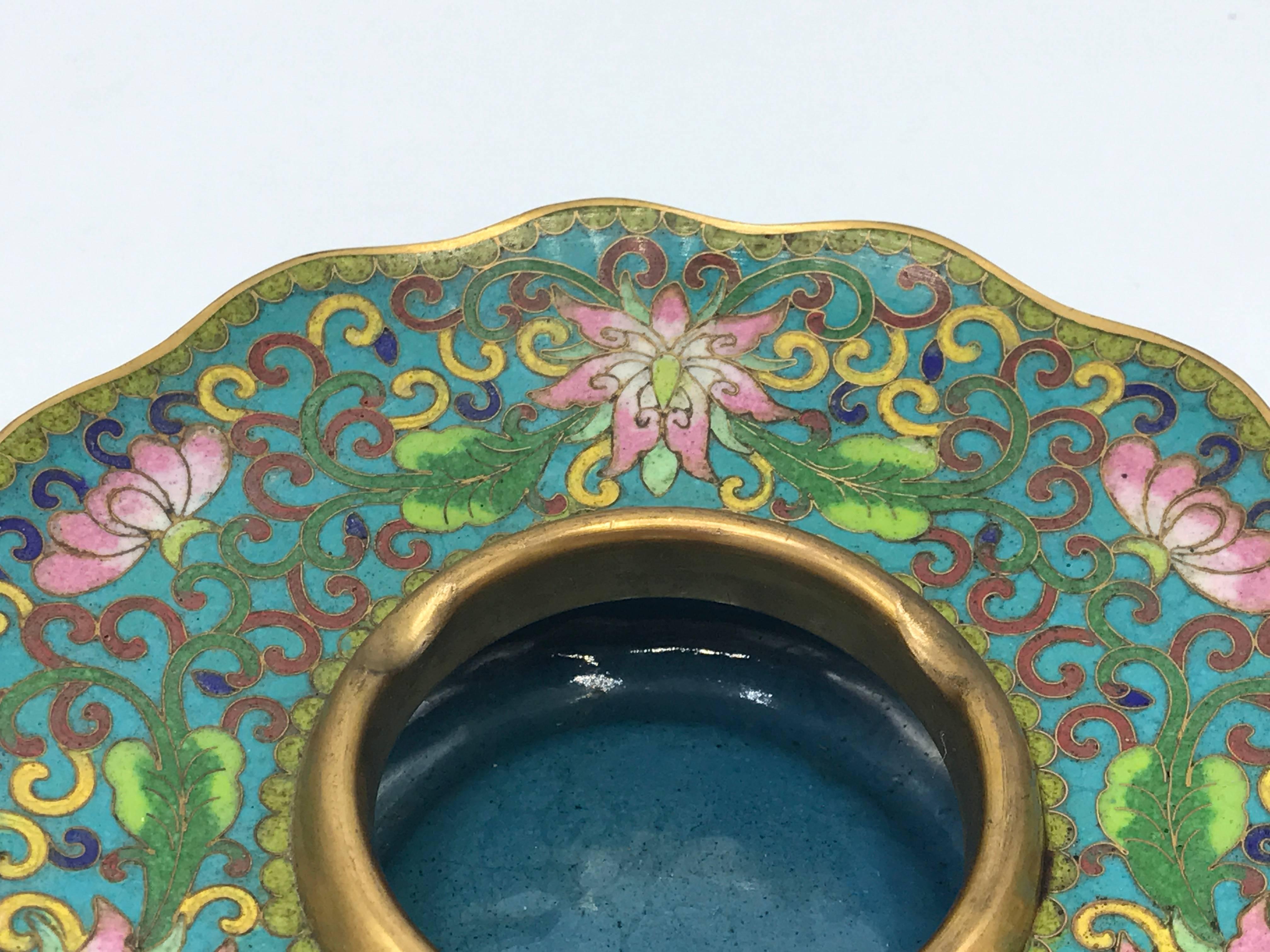 Offered is a gorgeous, 1950s cloisonné blue and green ashtray with a floral motif. Looks as if it was never used.