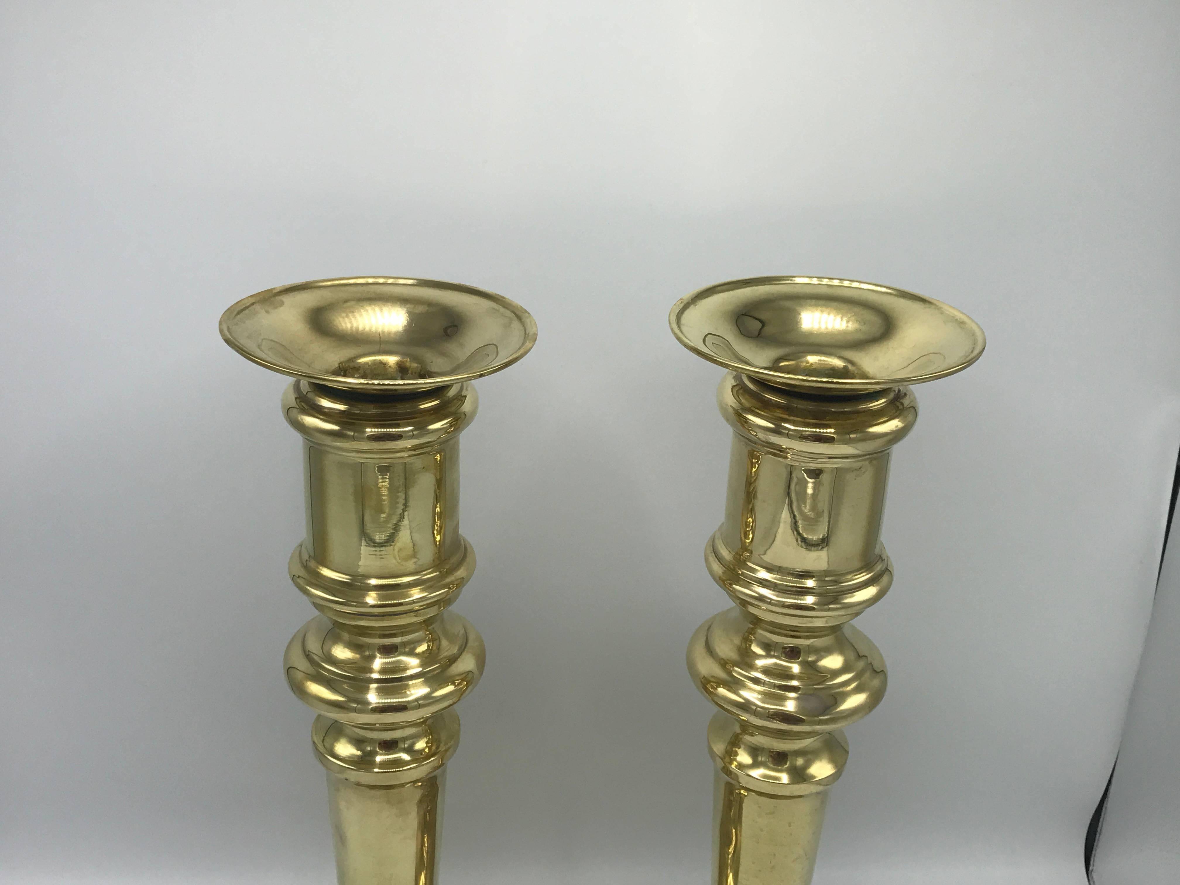 Offered is a stunning and substantial, pair of 1970s Dunhill brass candlestick holders. Heavy. Previous owner converted them into lamps, they still have the small hole in the back and top centre to convert back to lamps if buyer wishes to do so.