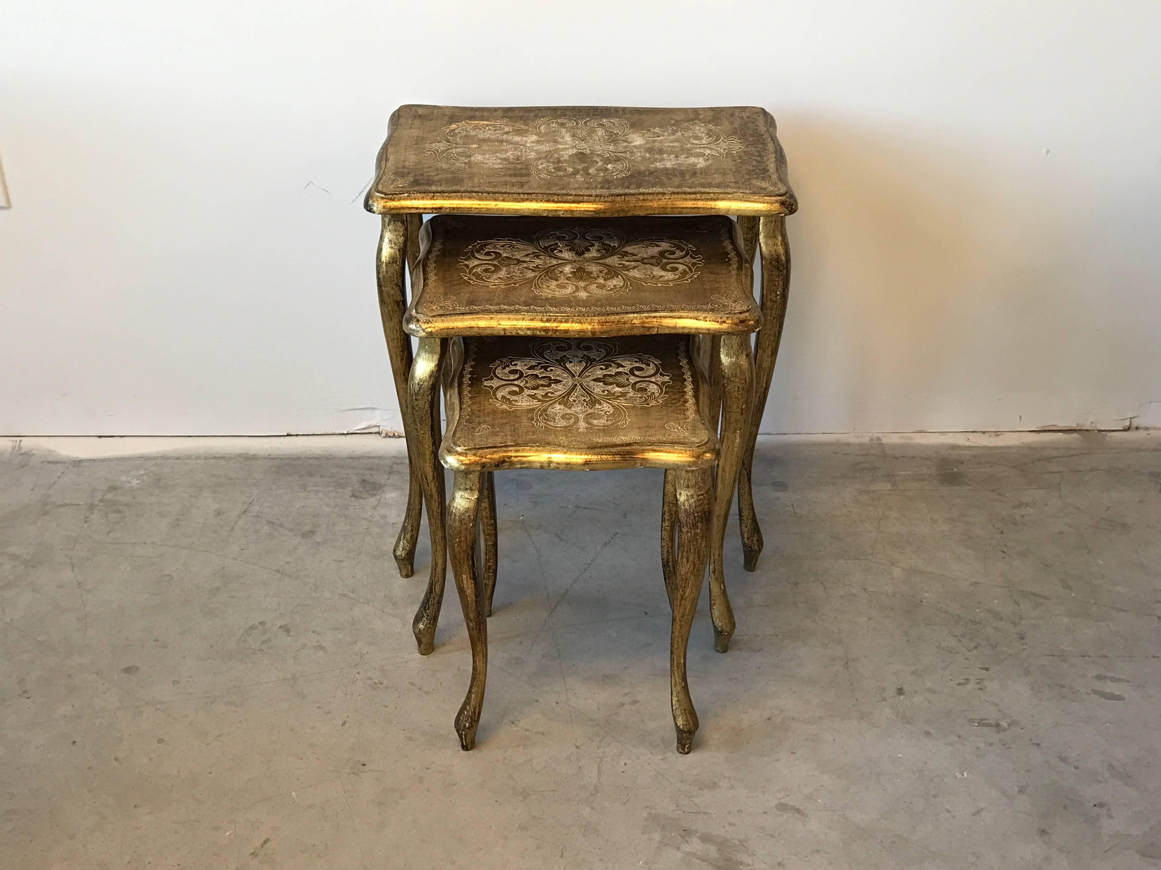 Offered is a gorgeous, set of three, 1950s Italian Florentine gilded wood nesting tables. Excellent condition, absolutely beautiful. 

Measures: Large 23" x 21.5" x 13.5"
Medium 20.25" x 16.5" x 11.5"
Small
