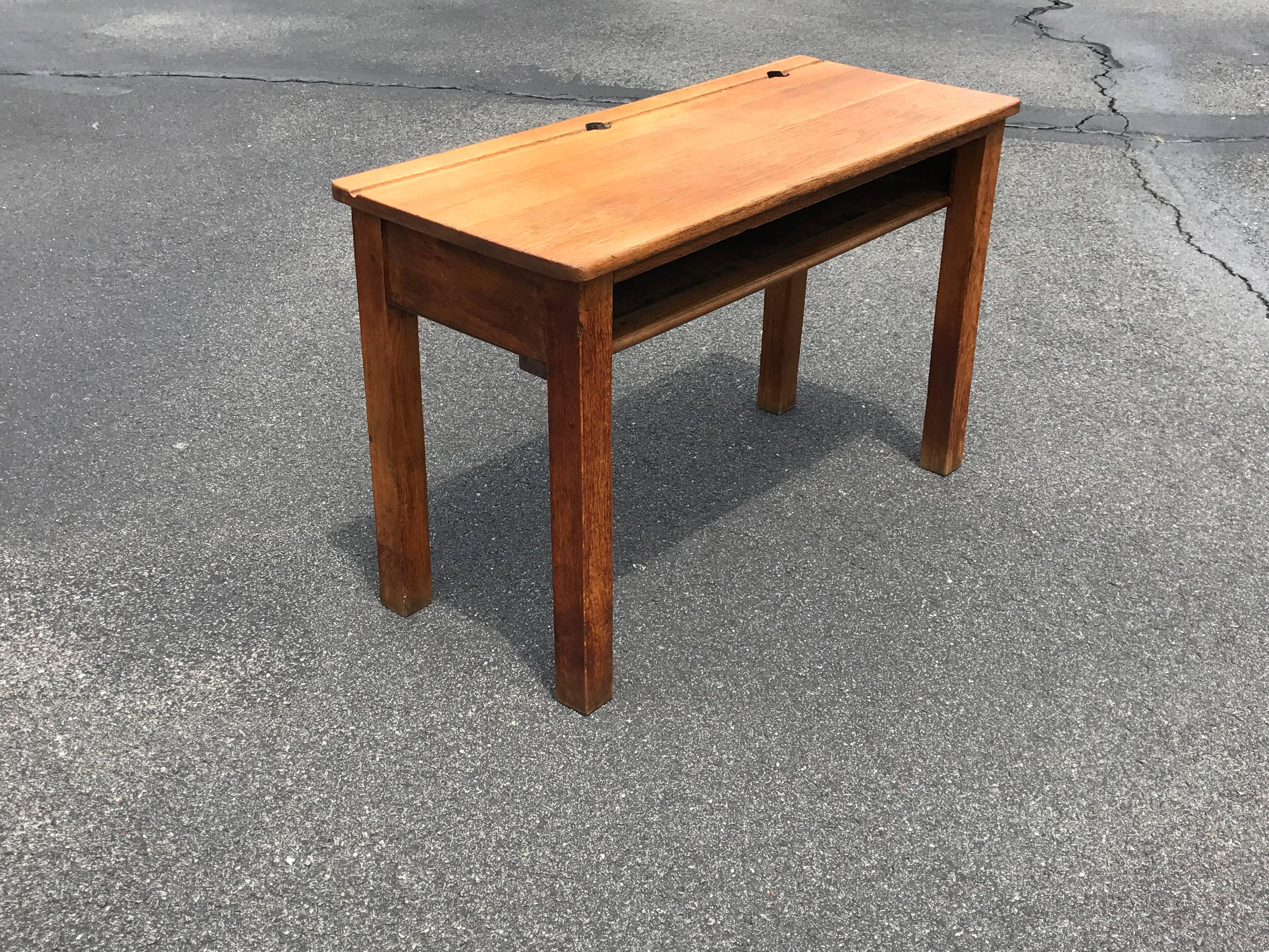 Offered is a beautiful, 19th century English oak double school desk. Two inkwells, storage shelf. Freighted from England.