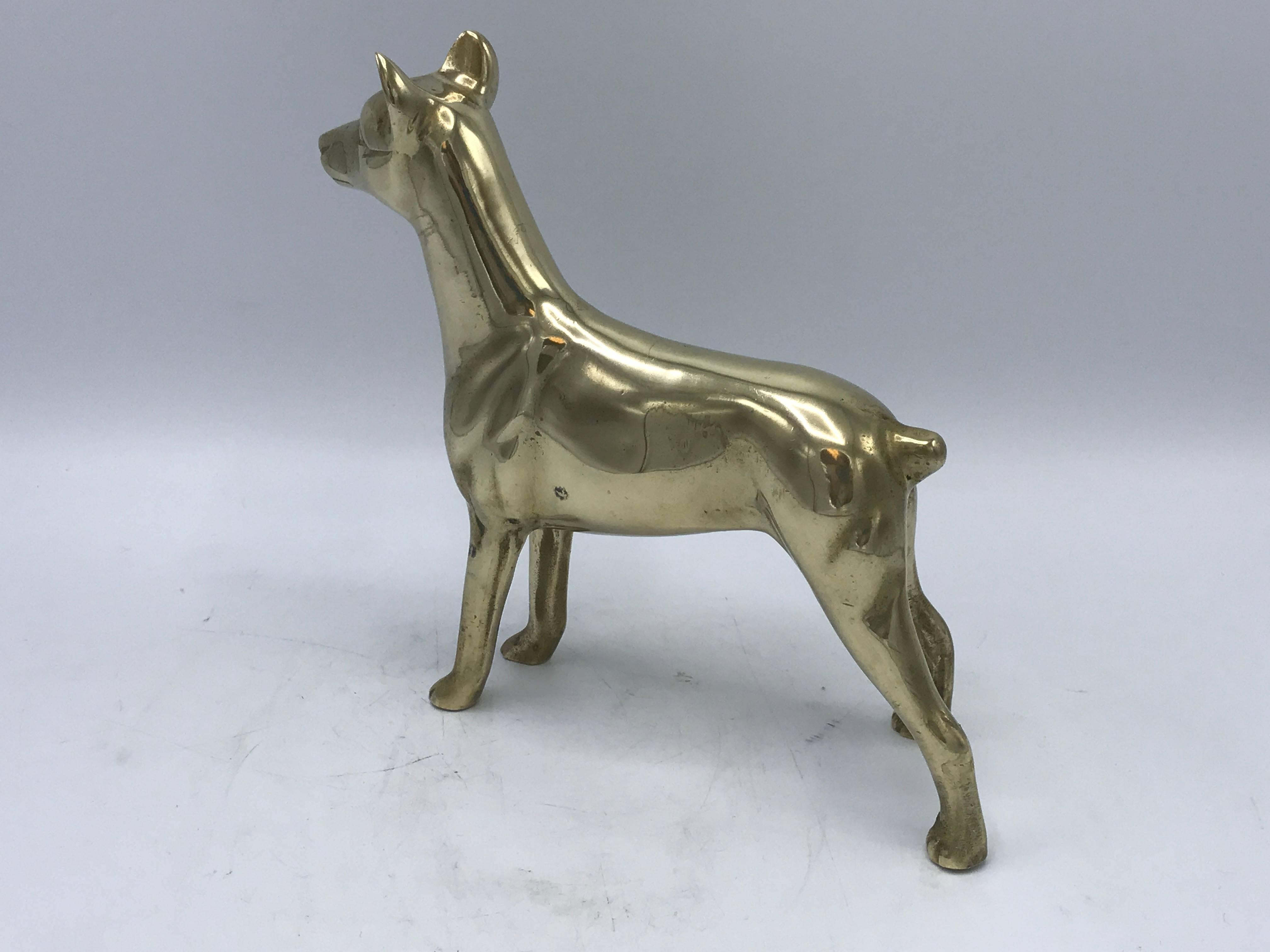 Offered is a beautiful, 1960s solid-brass Doberman dog sculpture.