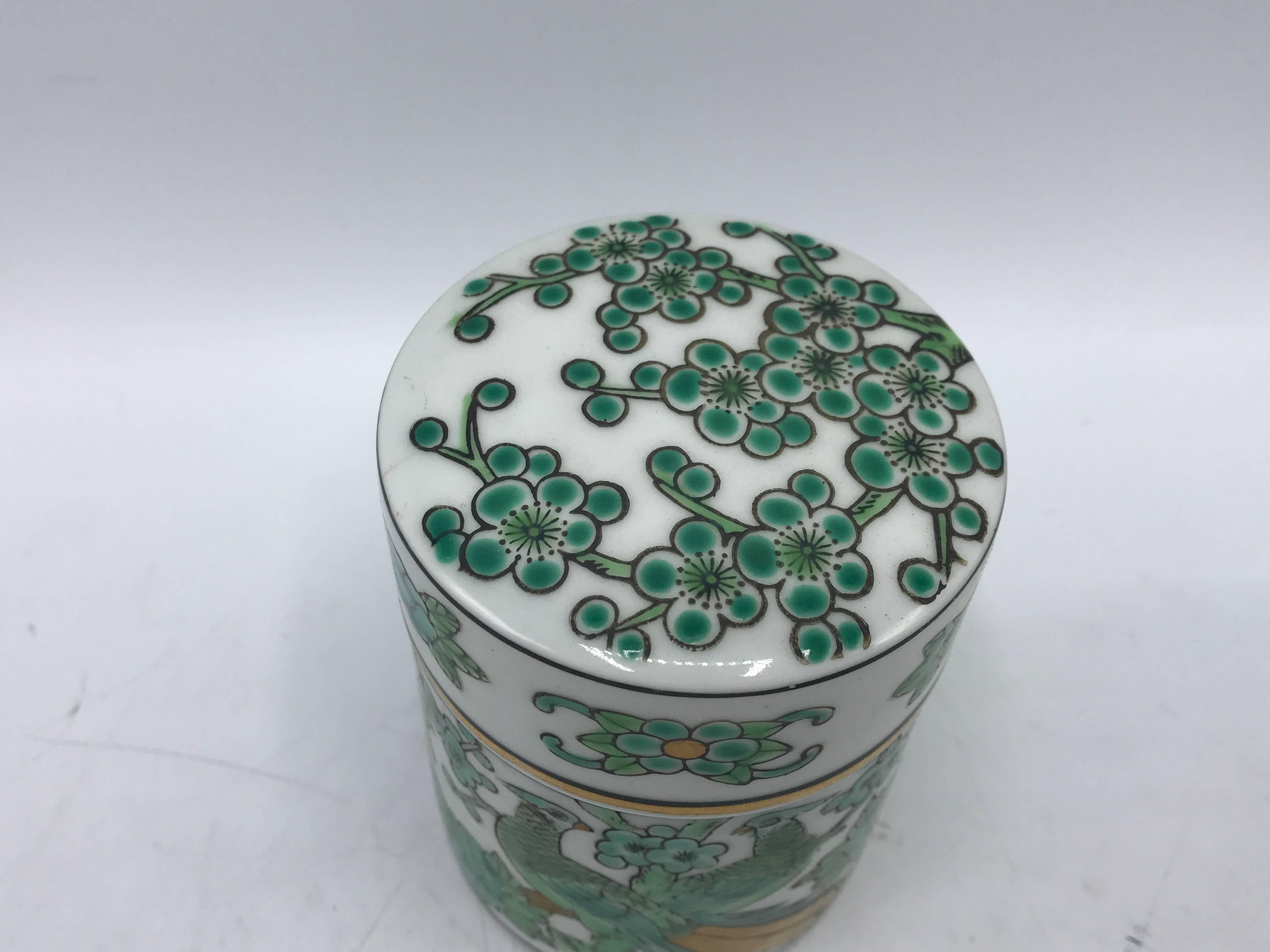 Offered is a fabulous, 1960s Gold Imari lidded jar with a hand-painted green and gold peacock motif. Marked on bottom.