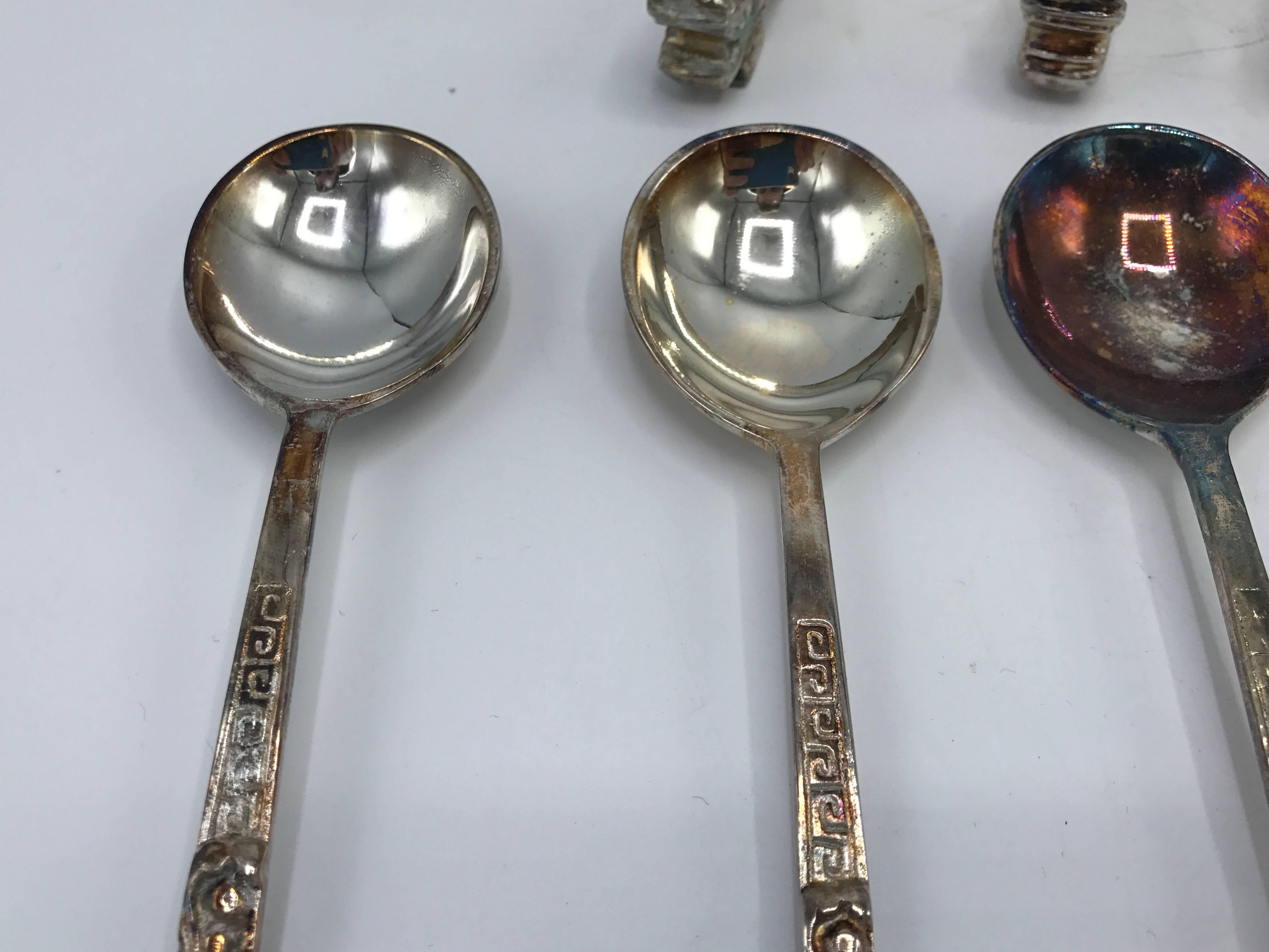 Offered is a gorgeous, set of eight, 1960s silver plate dragon motif spoons and spoon rests. Eight spoons and eight spoon rests.