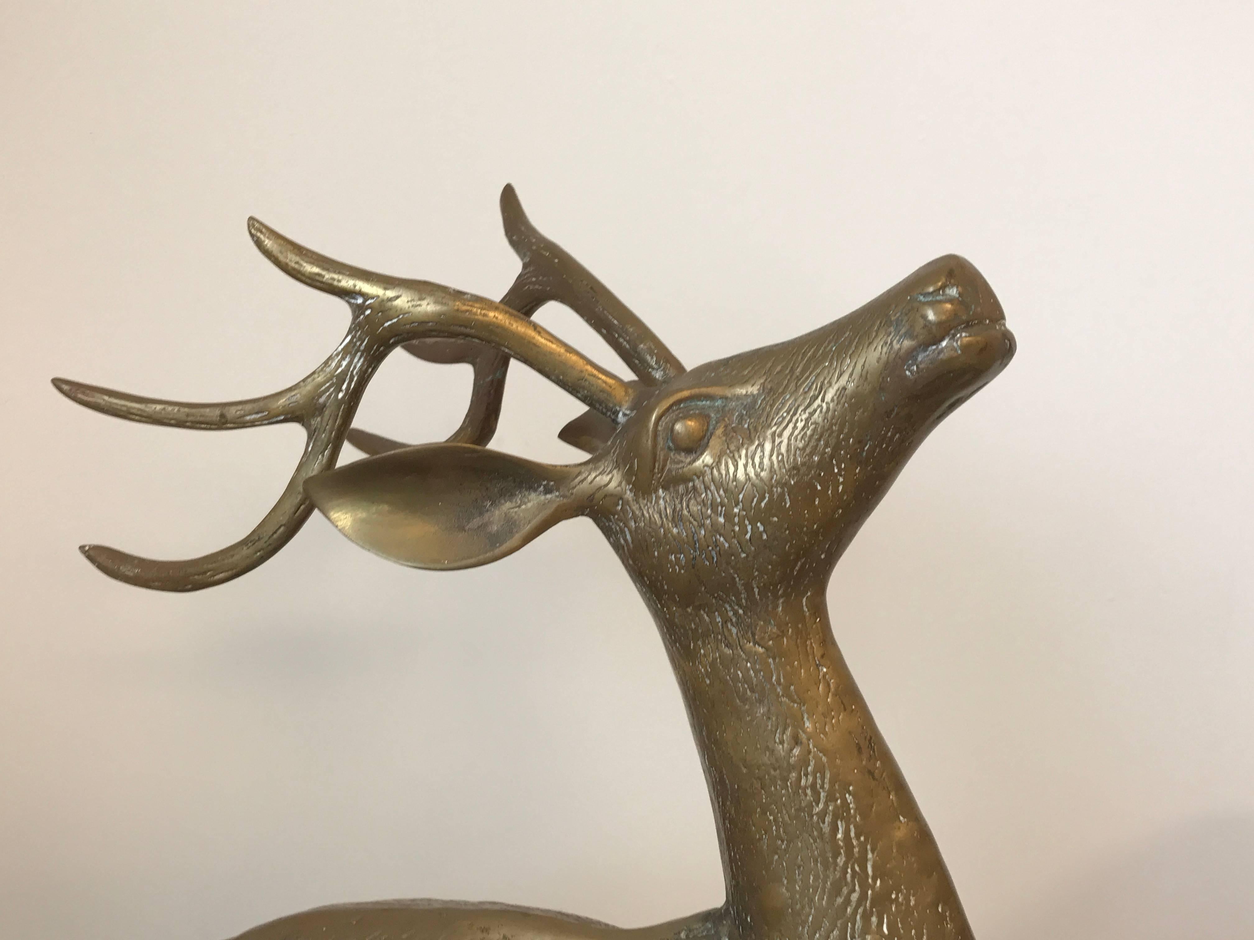 Offered is a beautiful, 1960s brass male and female deer sculptures.

Male measures: 22