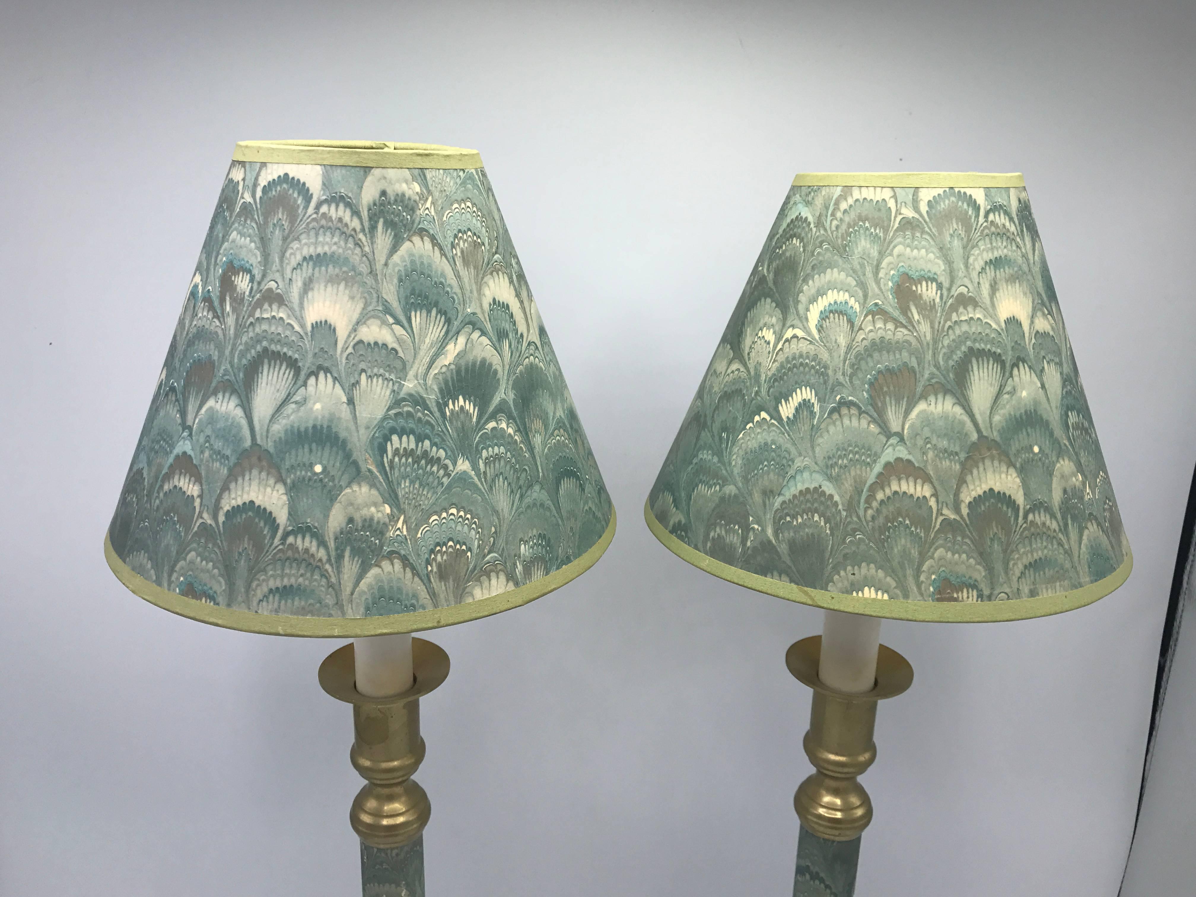 Offered is a gorgeous, pair of 1950s blue-green water-print candlestick lamps with brass bases. Includes matching shades. 20.5