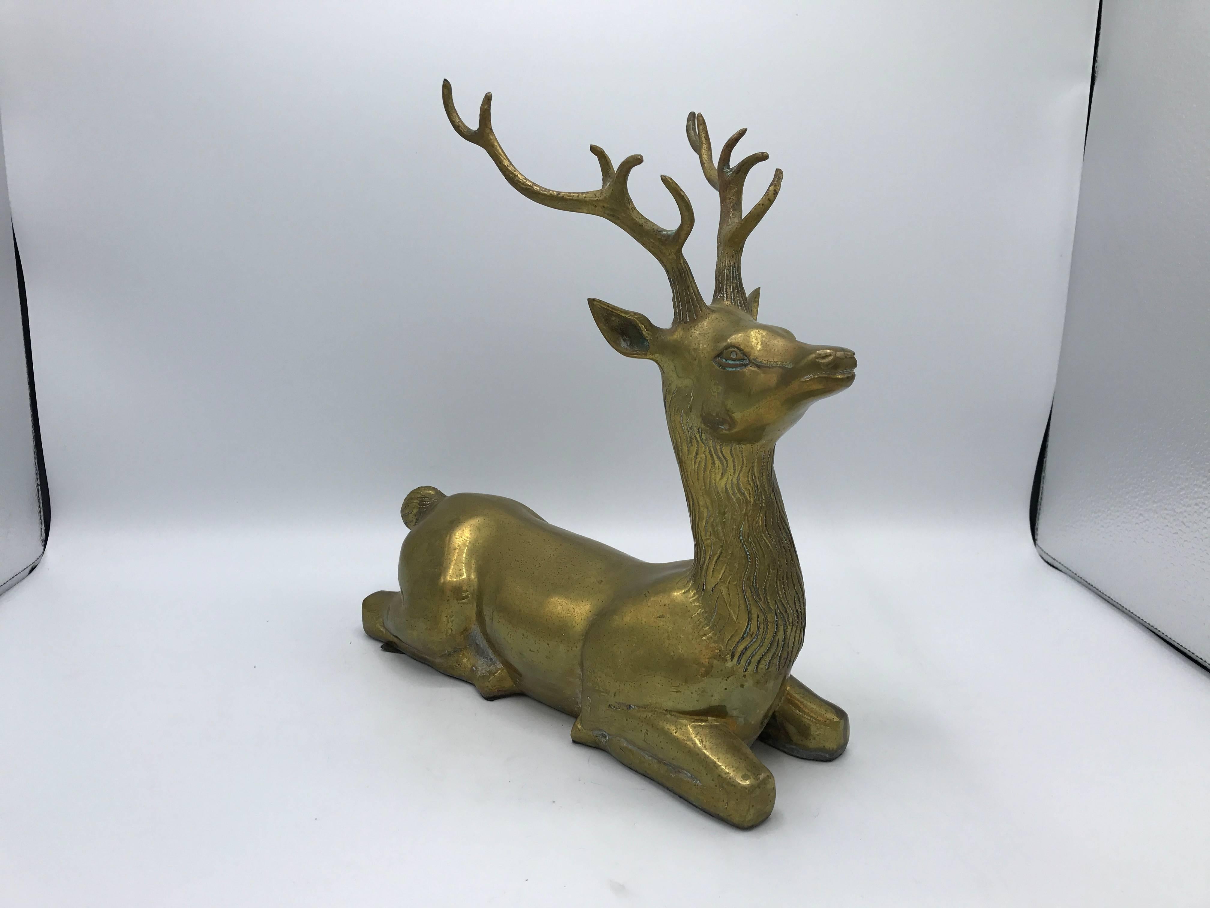 Offered is a beautiful, 1960s brass seated deer sculpture.