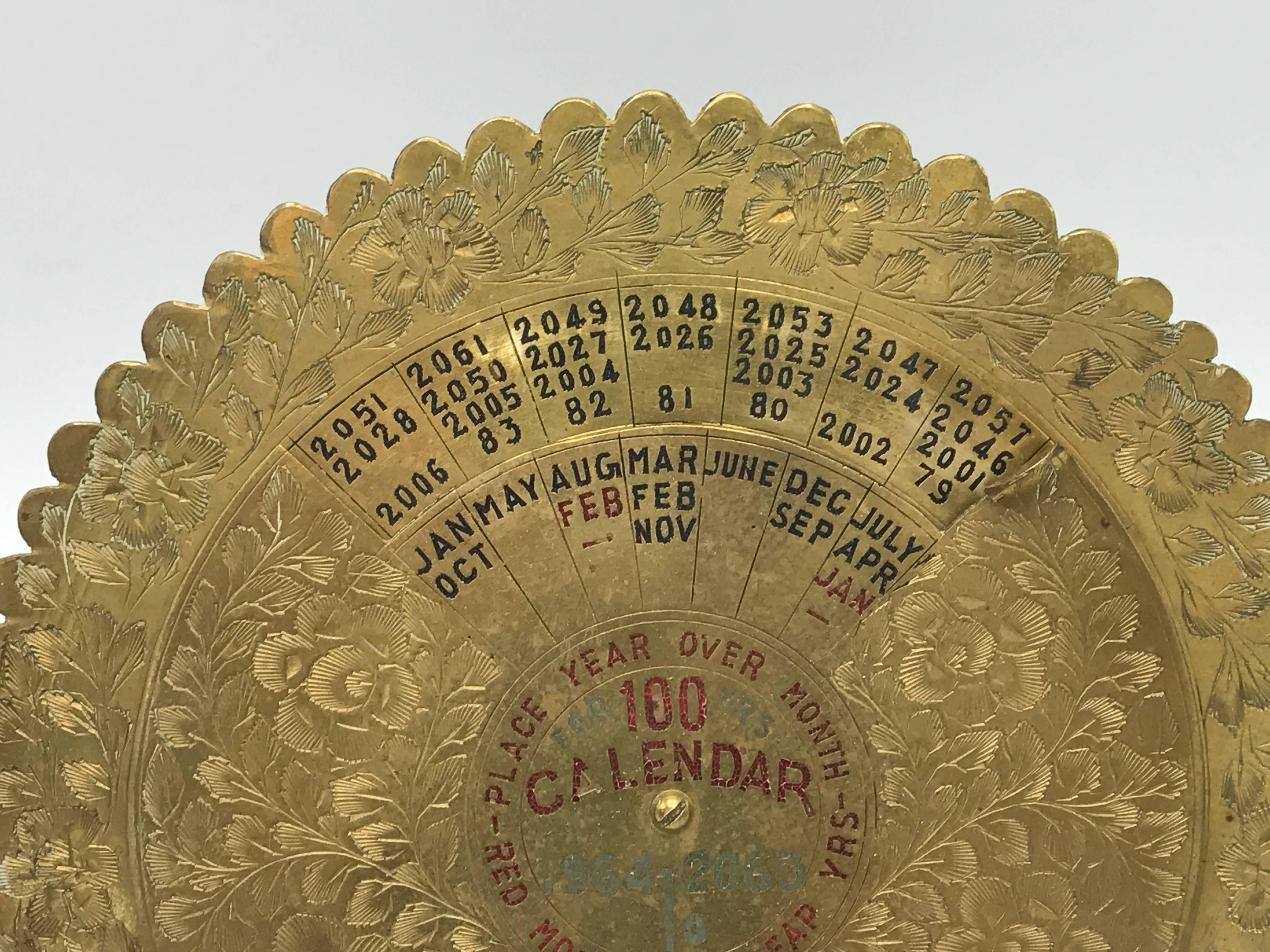 Offered is a fabulous, 1960s brass 100 year calendar, 1964-2063. Marked: India. With stand, though can hang on wall.