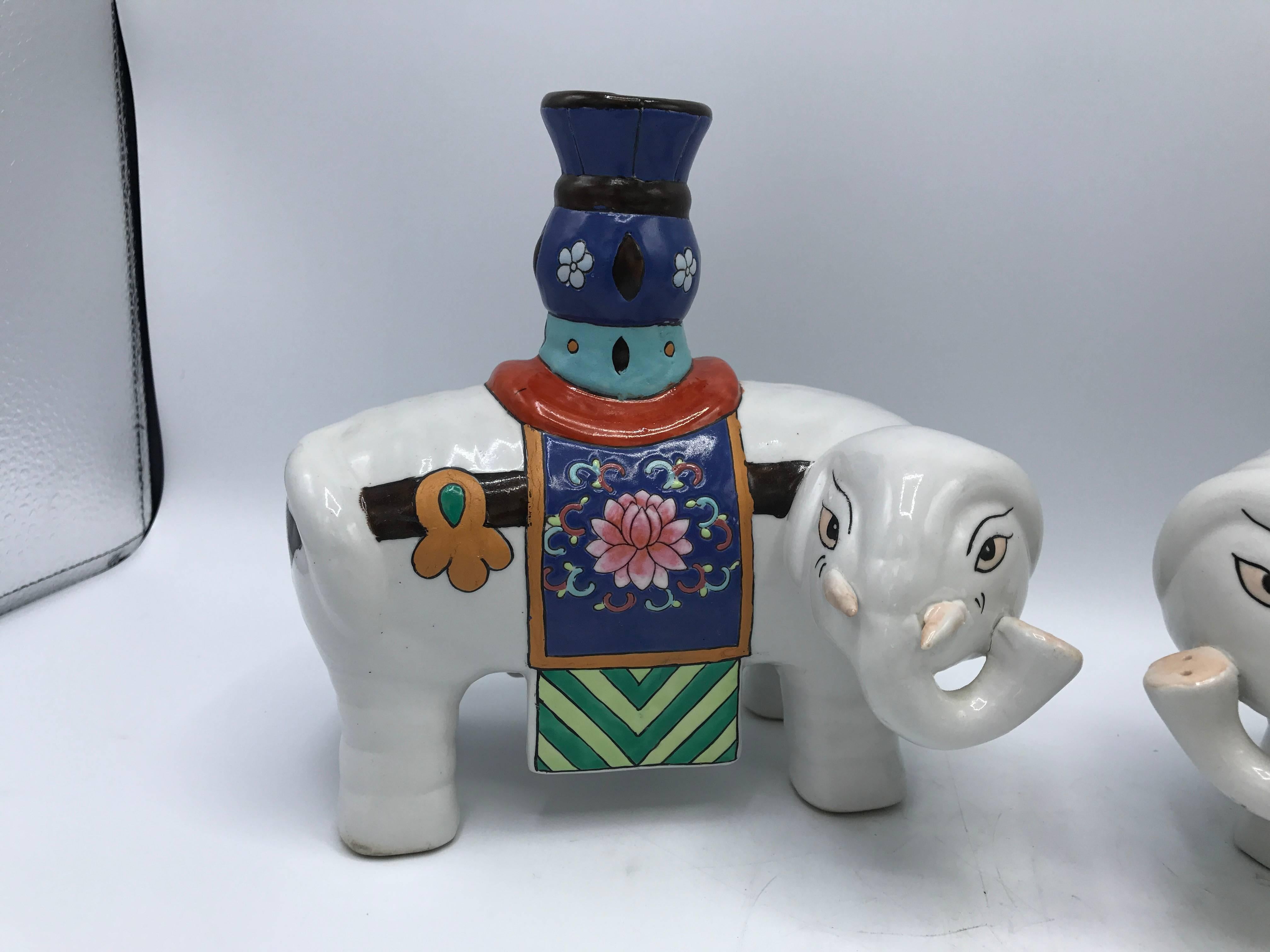 Offered is a gorgeous and fun, pair of 1960s polychrome ceramic elephant sculpture candlestick holders.