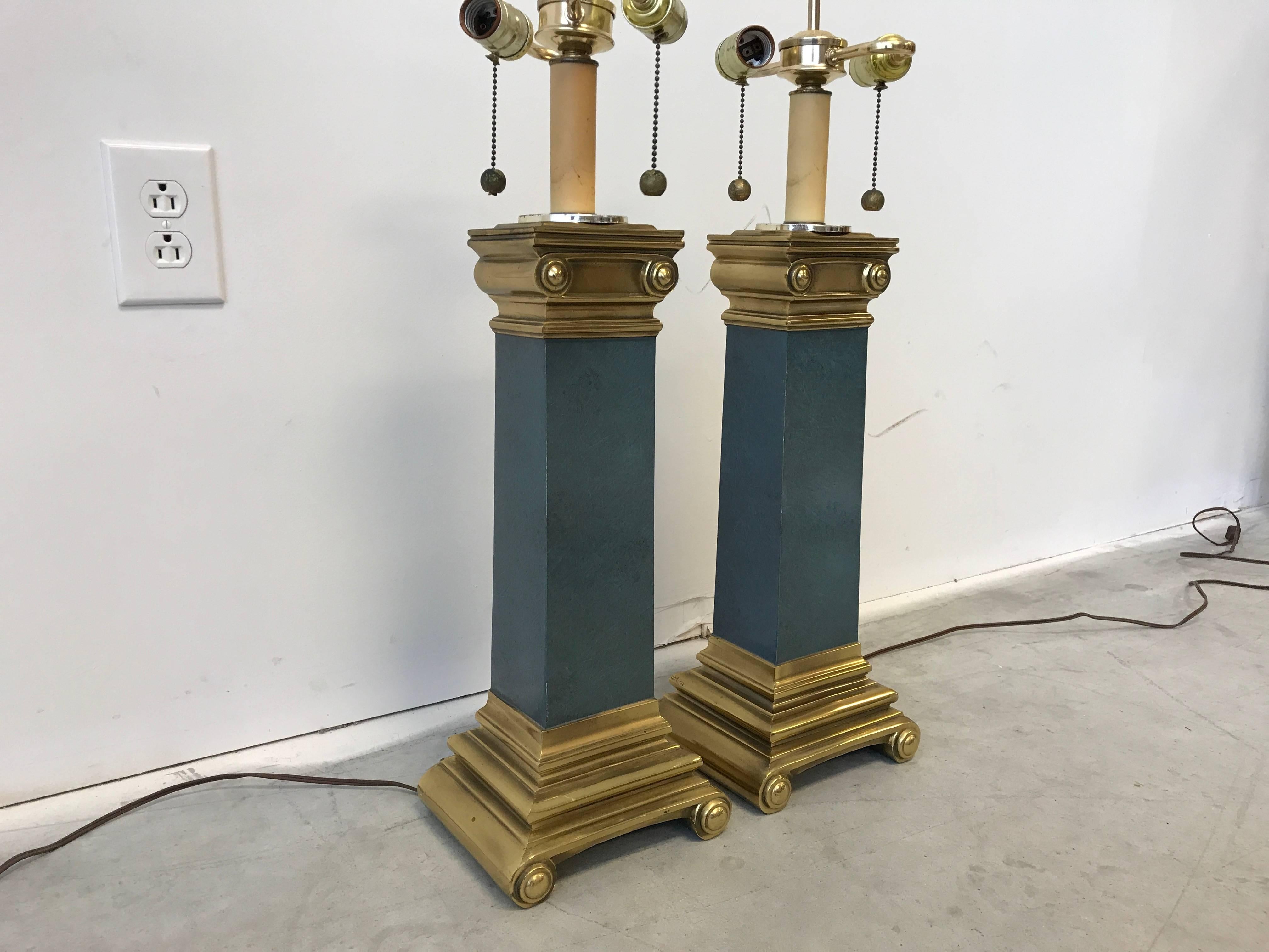 Offered is an extraordinary, pair of 1960s Italian brass scroll and faux stone lamps. Heavy. Double bulb fixture.