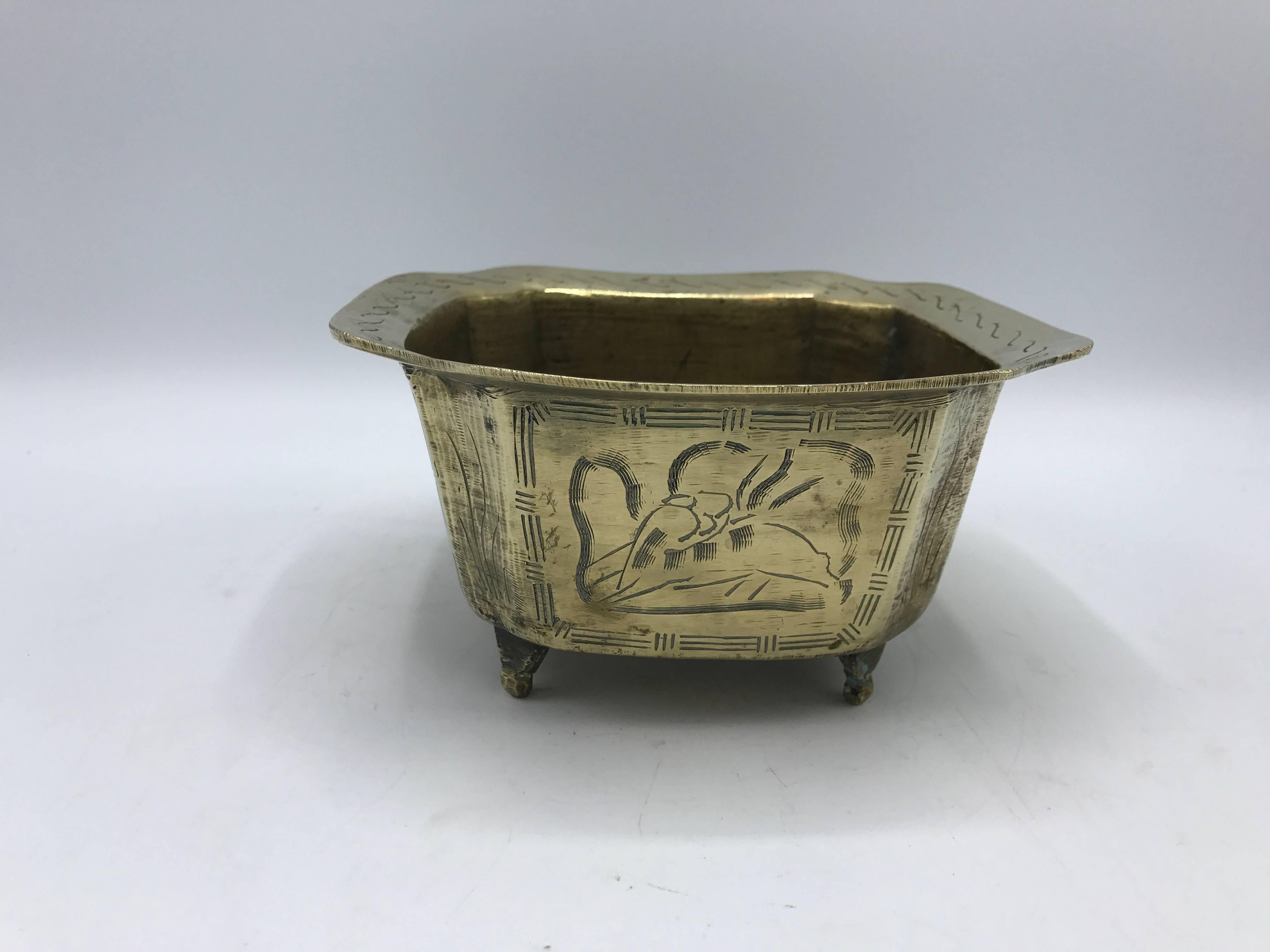 Offered is a beautiful, 1960s brass chinoiserie cachepot planter with ornate detailing on all sides. Marked 