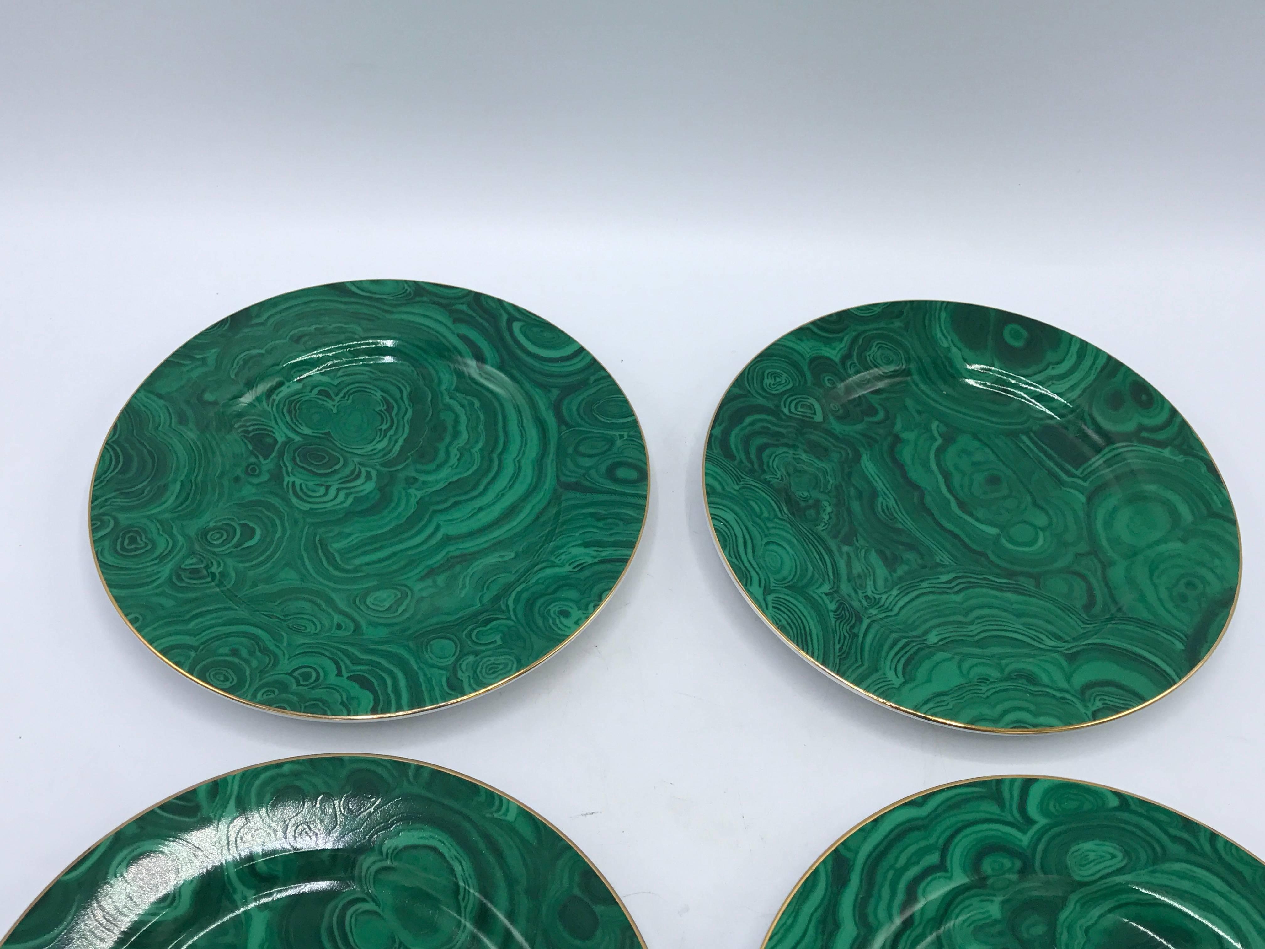 Offered is a stunning set of four, 1980s Neiman Marcus hand-painted malachite porcelain dessert plates with a gold 24-carat band around the perimeter. Marked on underside.